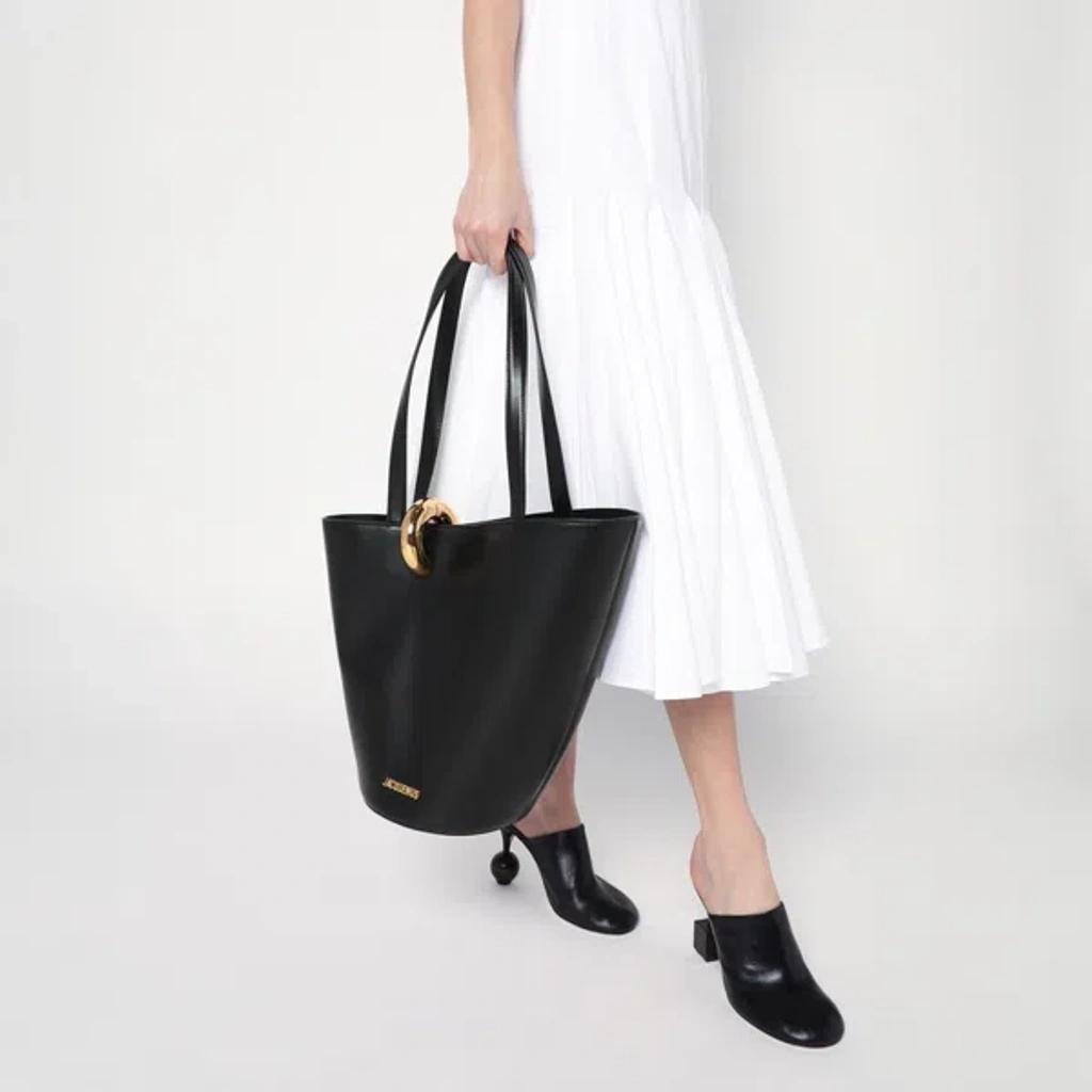 JACQUEMUS The Medium Bambola Asymmetric Leather Bucket Bag In Black 990 Product Image