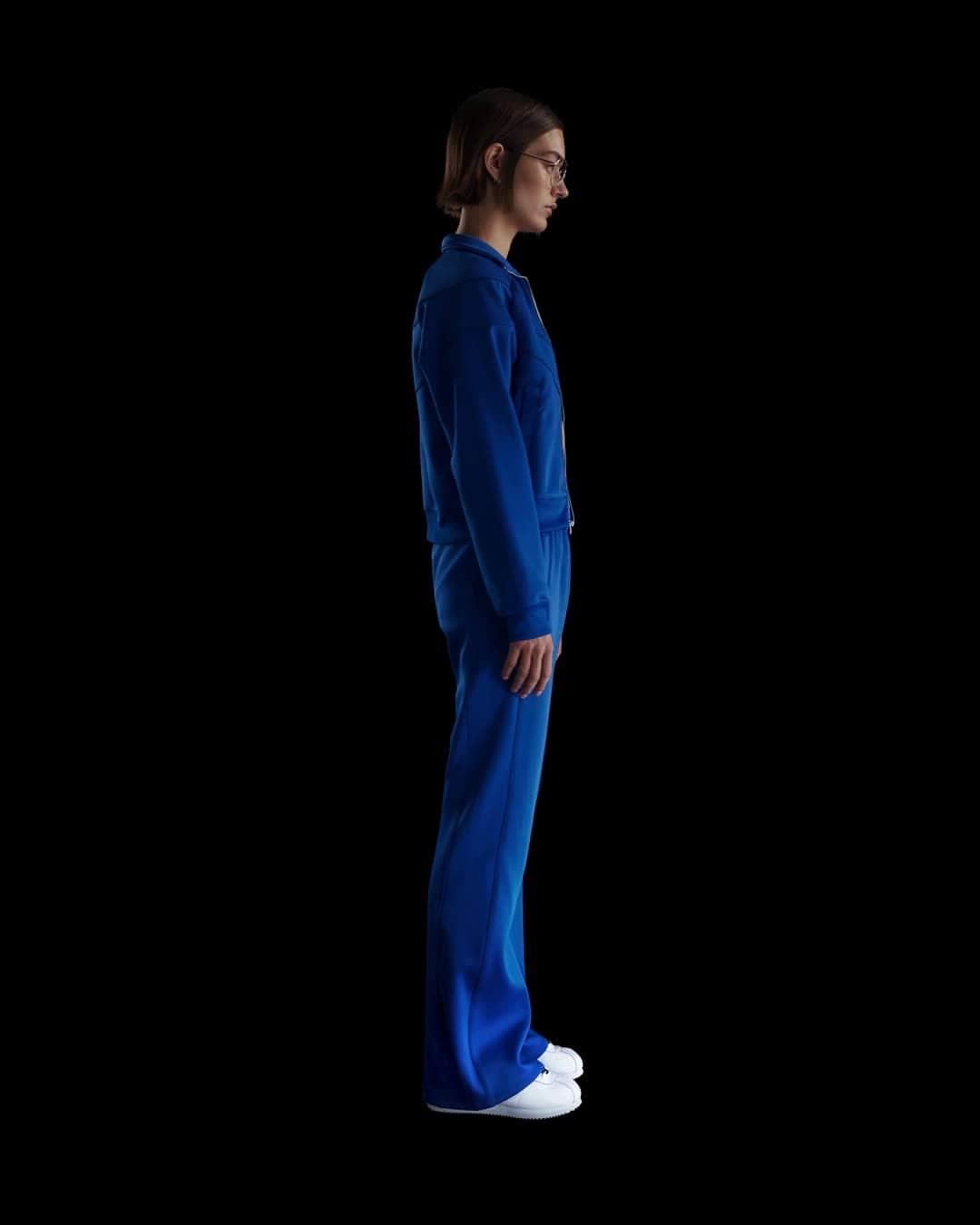 Womens Nike Sportswear Windrunner Mid-Rise Slim Knit Pants | HJ1016-010 Product Image