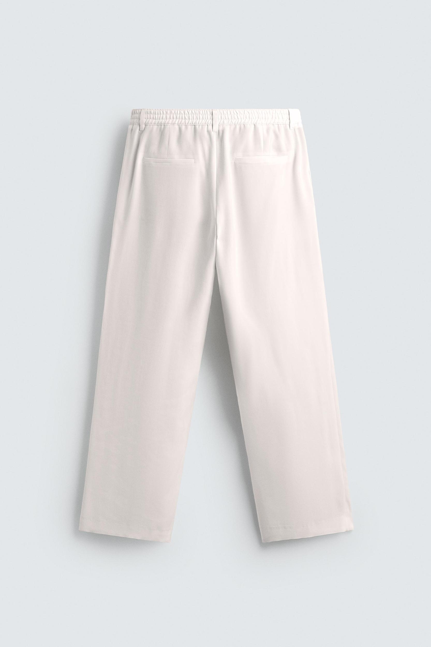 RELAXED FIT PLEATED PANTS Product Image