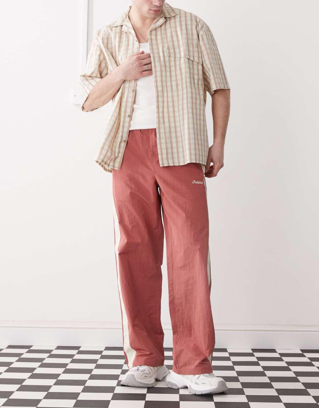 Prohibited stripe track pants in red Product Image