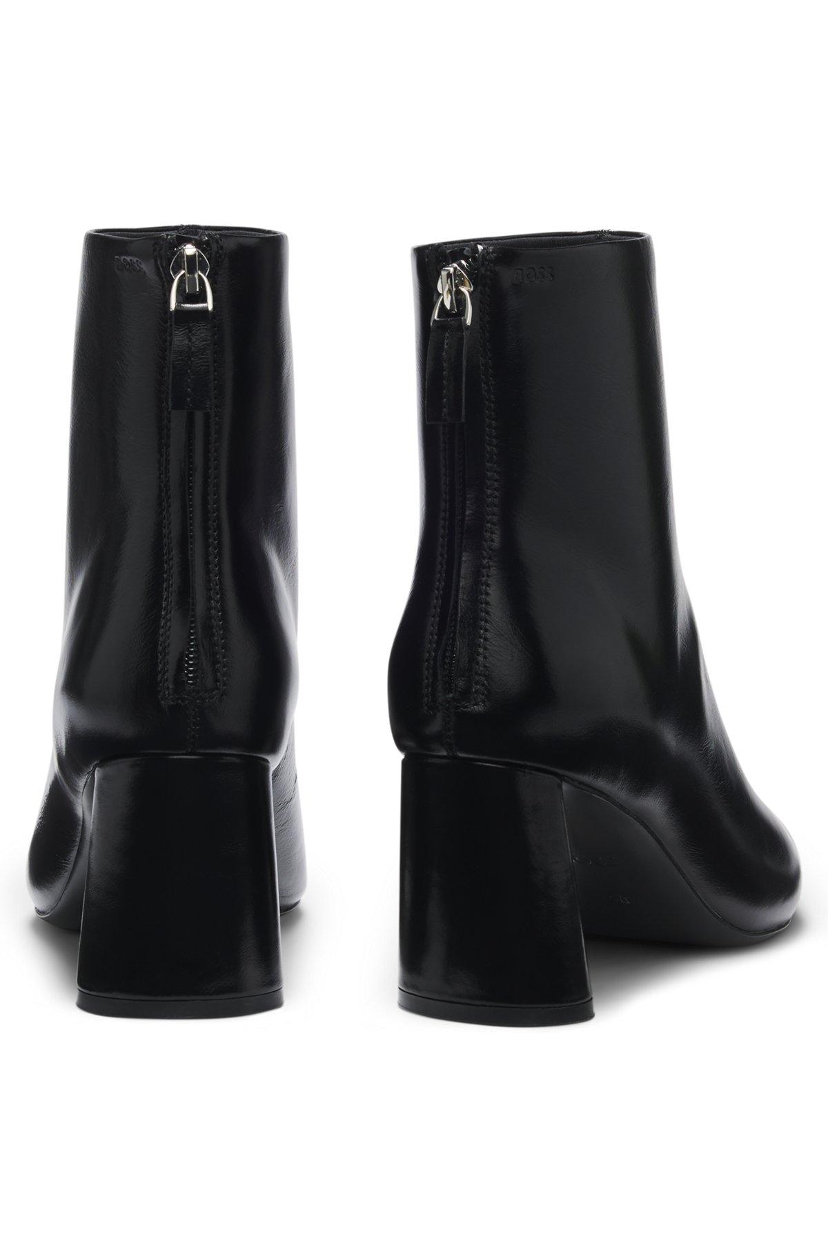Ankle boots in leather with embossed logo Product Image