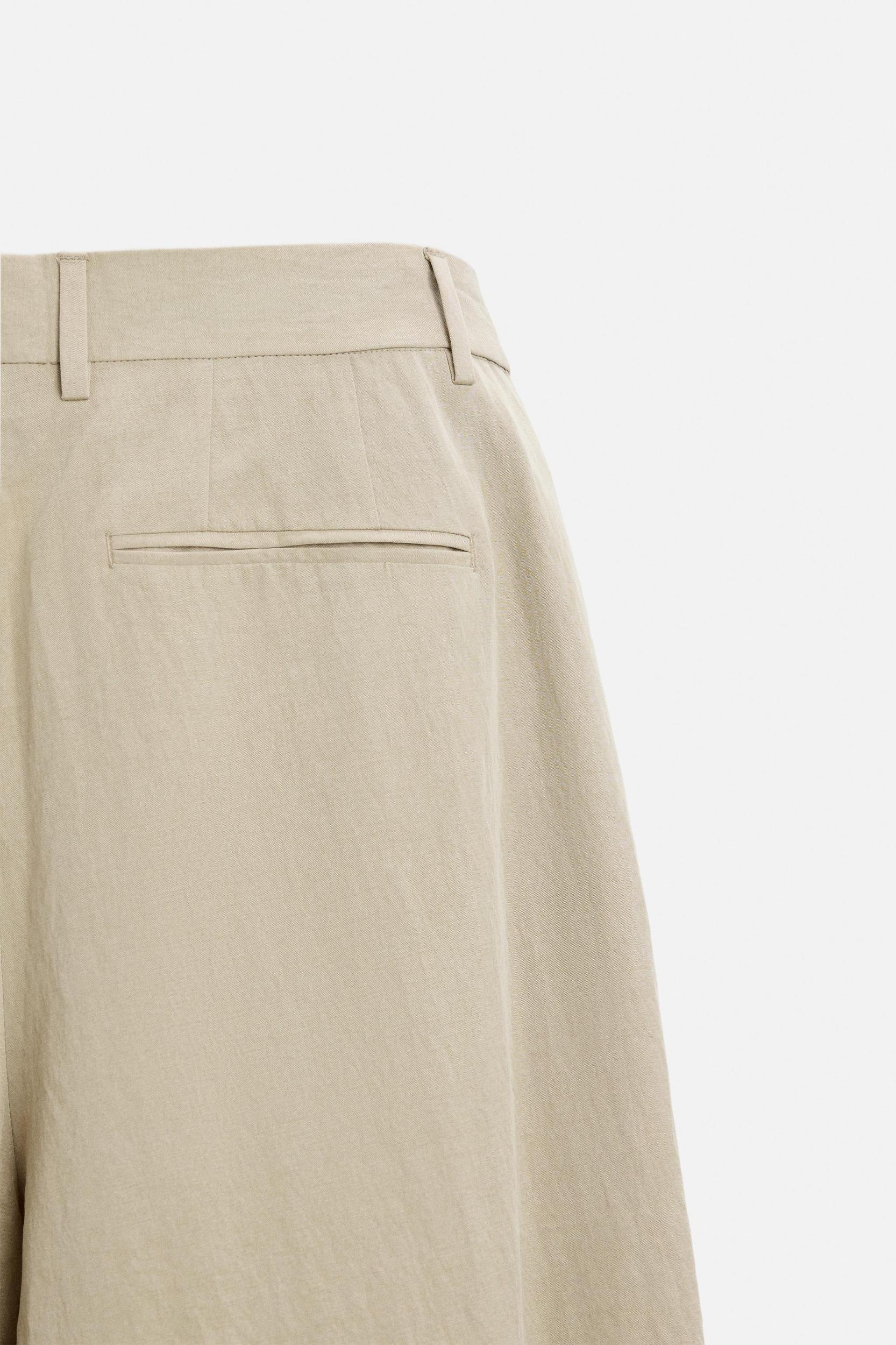 PLEATED WIDE FIT PANTS Product Image