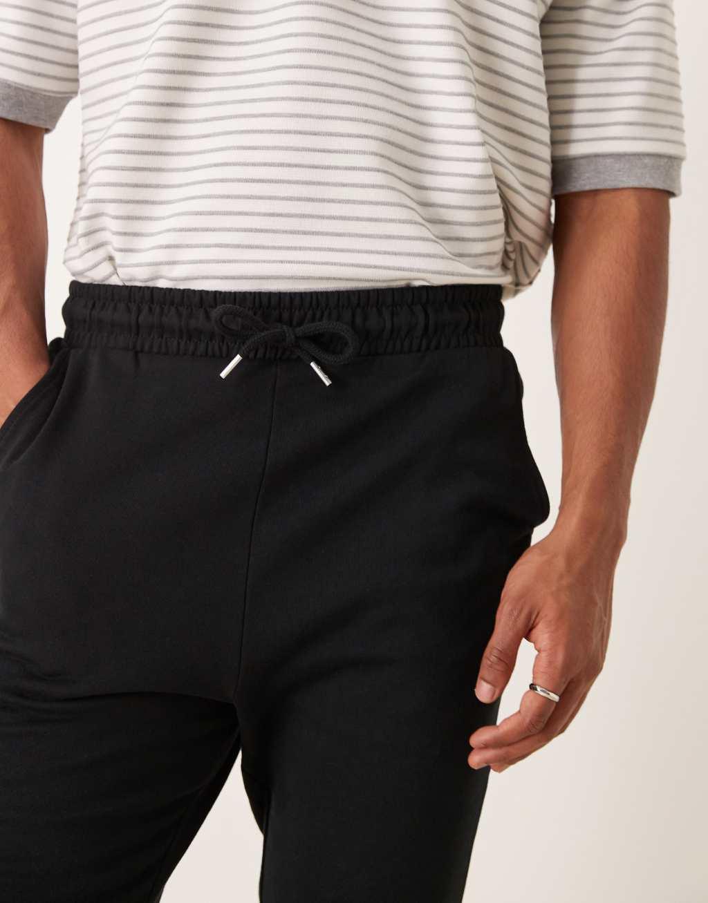 ASOS DESIGN essential skinny sweatpants in black Product Image