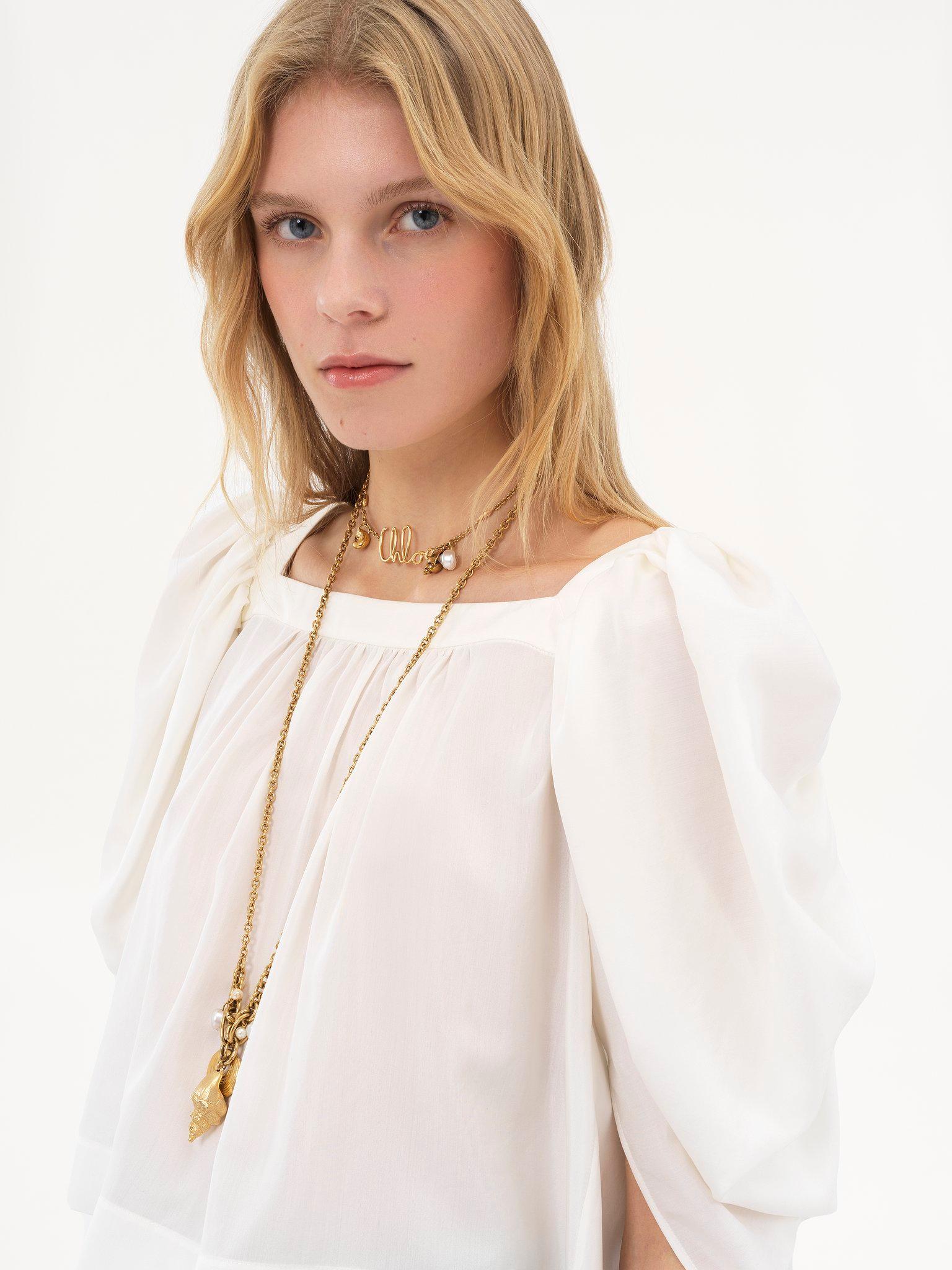 Puff-sleeve pleated top in silk poplin Product Image