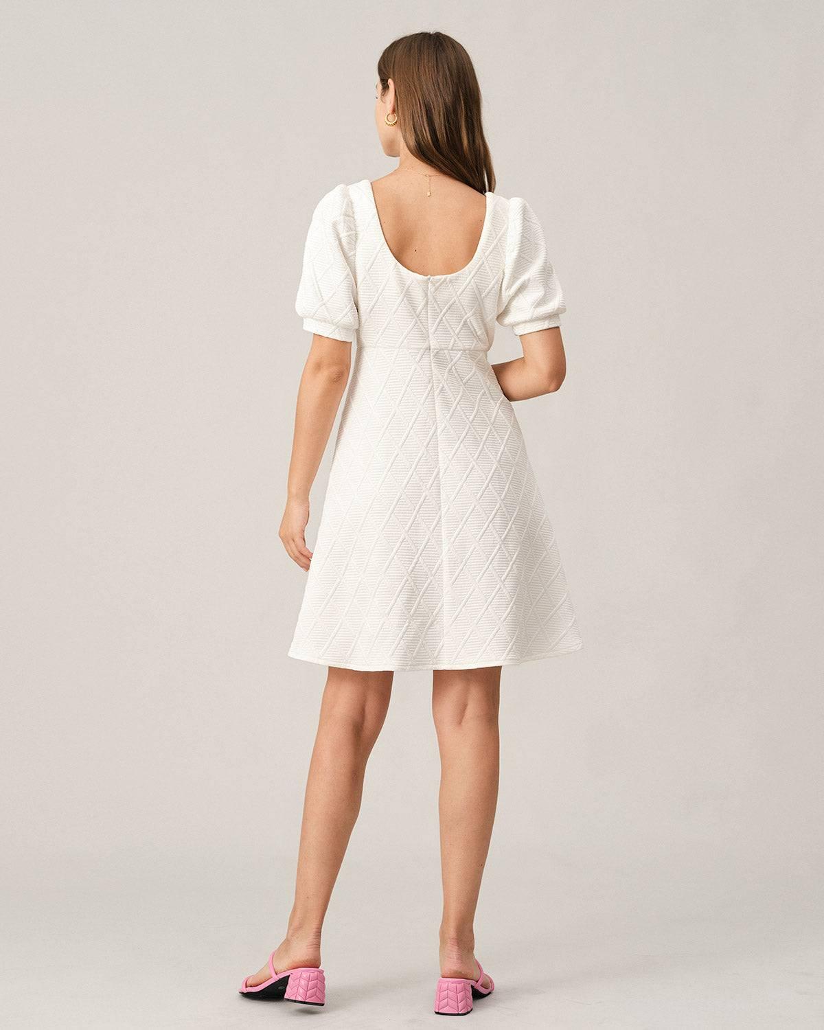 The Solid Textured Puff Sleeve Mini Dress Female Product Image