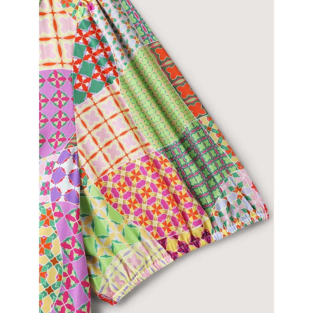 Plus Size Multicolor Vibrant Collage Print Babydoll Top Women Playful Short sleeve Deep V-neck Vacation Blouses BloomChic 26/4X Product Image