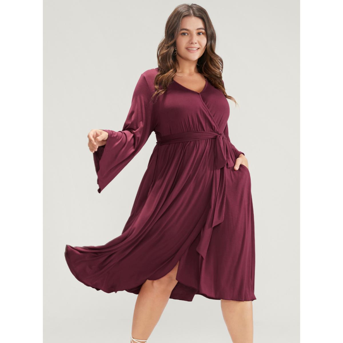 Plus Size Solid Wrap Knotted Front Pocket Bell Sleeve Asymmetrical Hem Dress Burgundy Women Elegant Wrap V-neck Long Sleeve Curvy Midi Dress BloomChic 14-16/1X Product Image