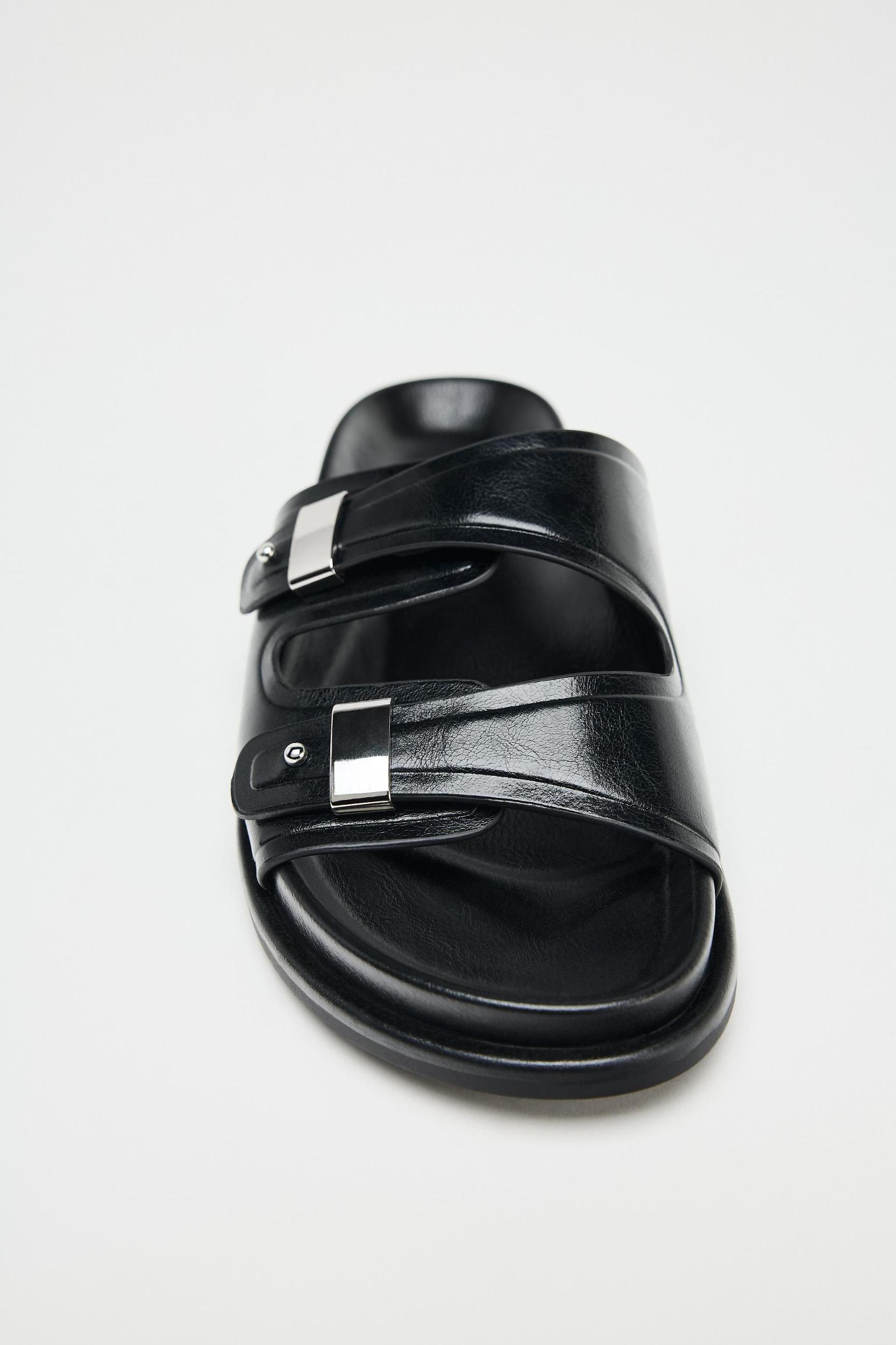 FLAT SANDALS WITH METALLIC DETAILS Product Image