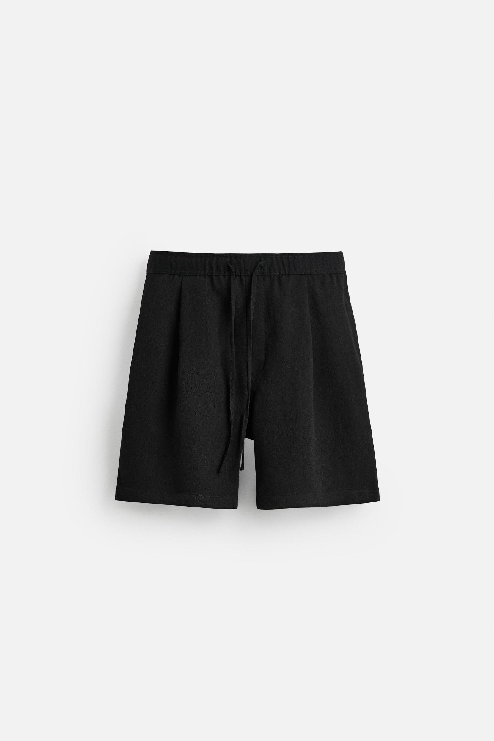 PLEATED FLOWY SHORTS Product Image