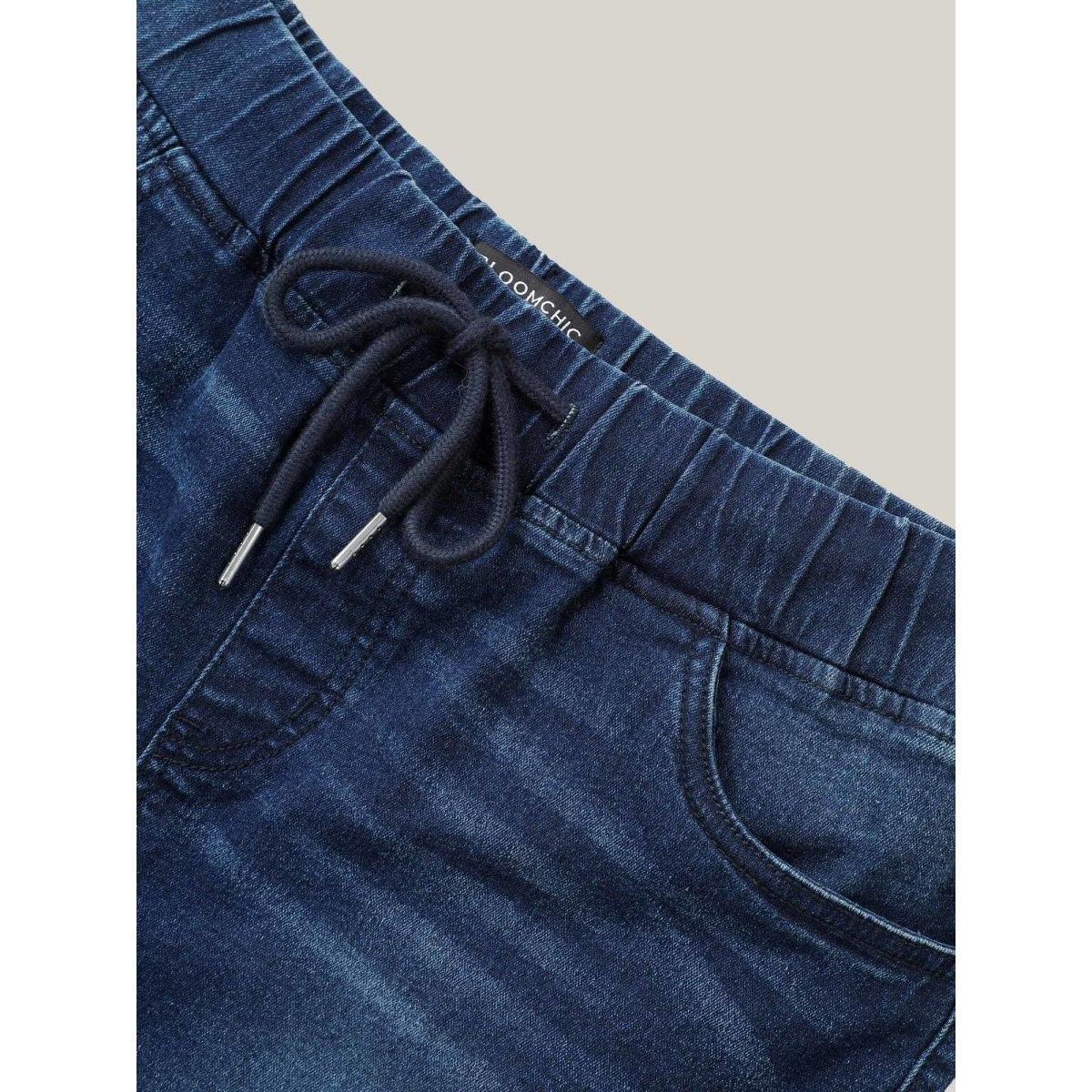 Plus Size Distressed Drawstring Roll Hem Denim Shorts Women Indigo Drawstring High stretch Casual Slanted pocket Leisure Denim Shorts BloomChic 28/5X Product Image