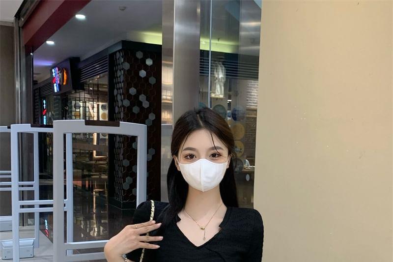 Short-Sleeve V-Neck Plain Slit Knit Top / High Rise Plain Maxi A-Line Skirt Product Image