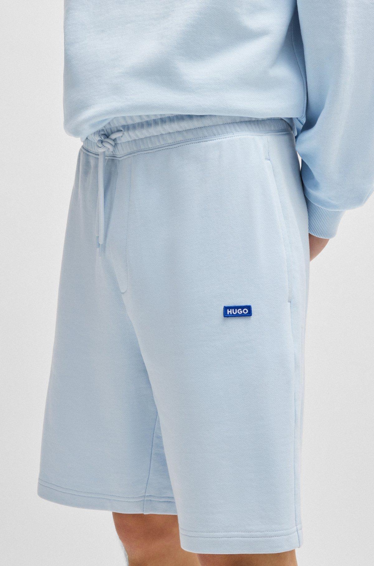 Cotton-terry shorts with blue logo patch Product Image