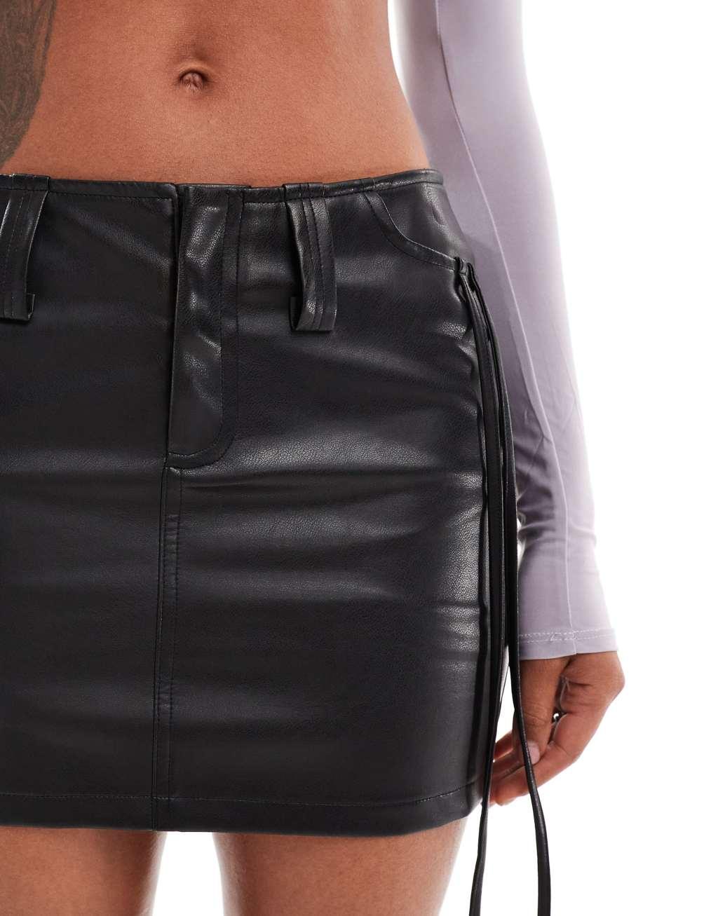 Aria Cove leather look tie side cargo mini skirt in black Product Image