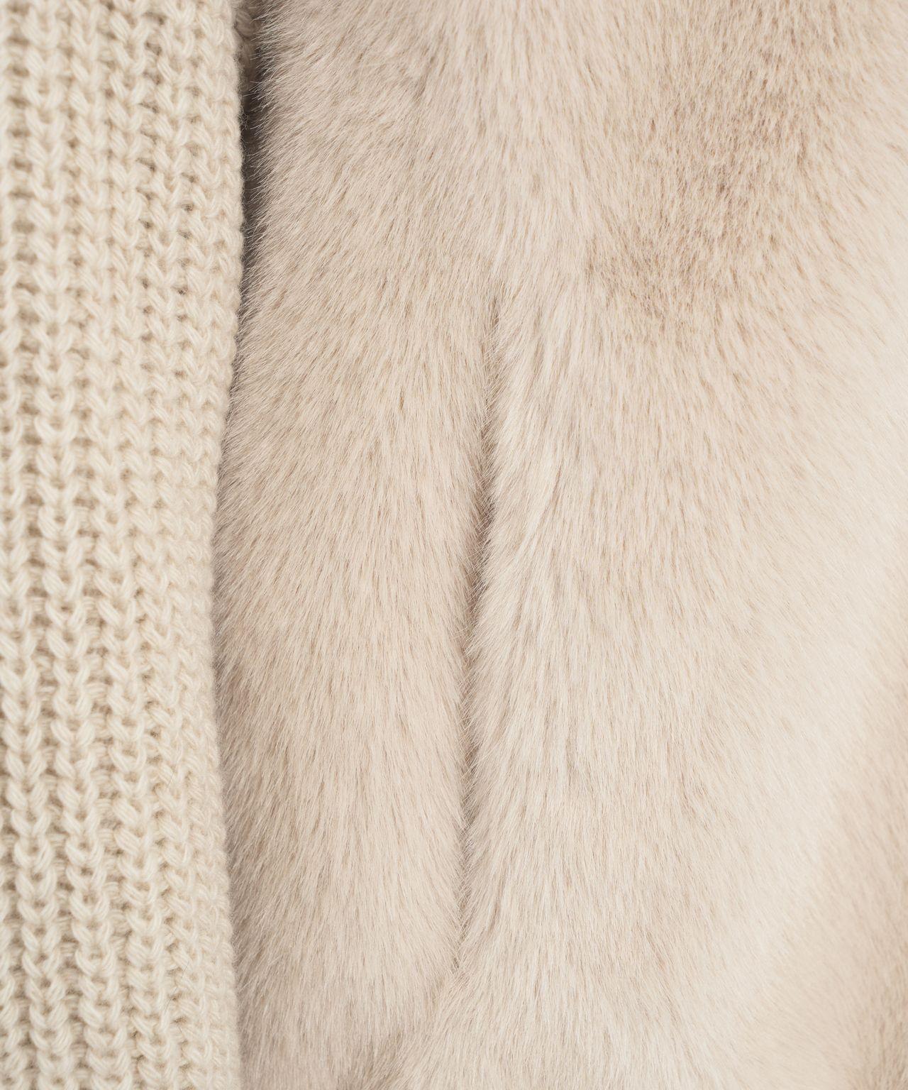 Faux fur jacket with knitted sleeves Product Image