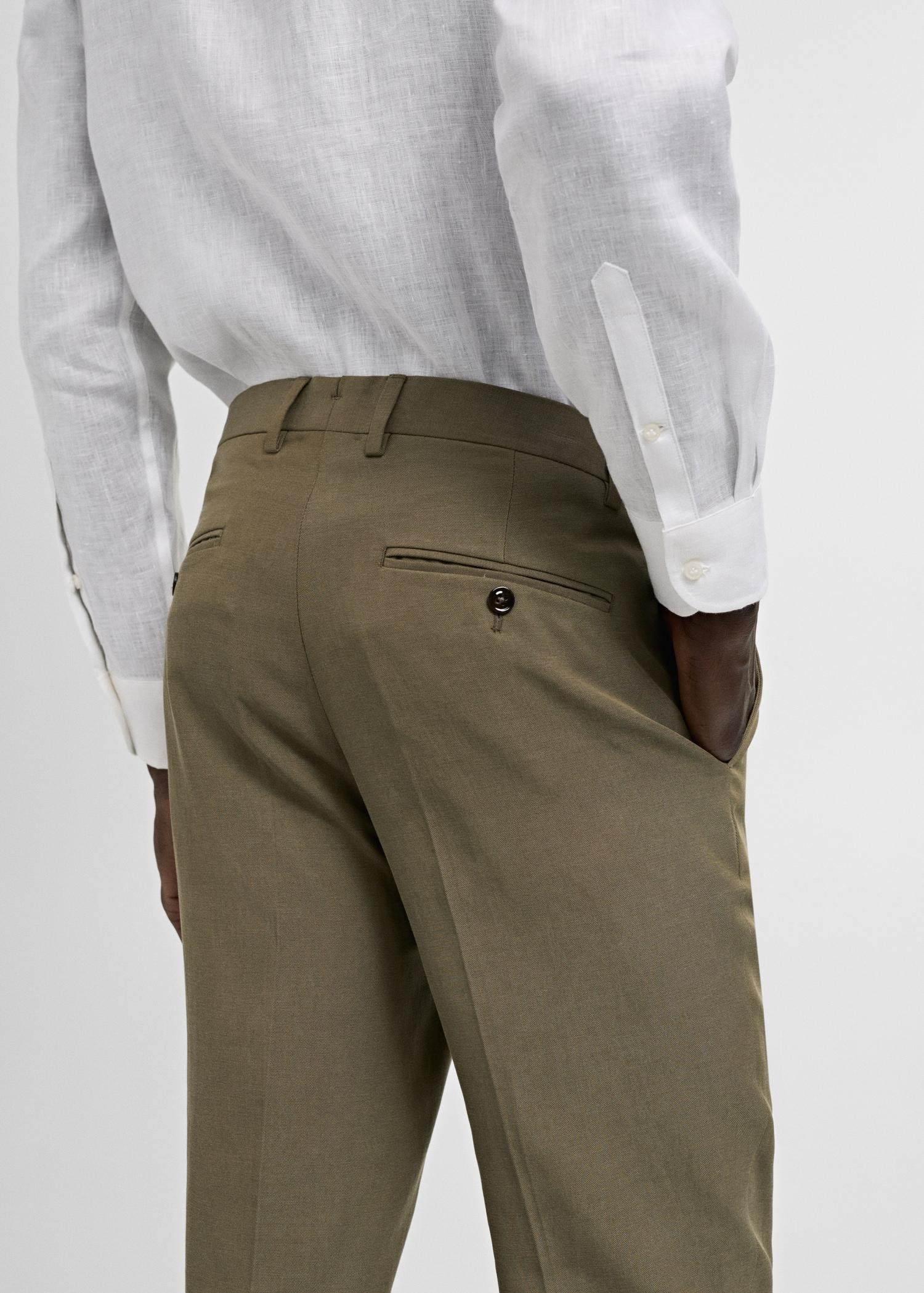 Slimfit Tencel™ suit pants with pleats - Men | MANGO USA Product Image