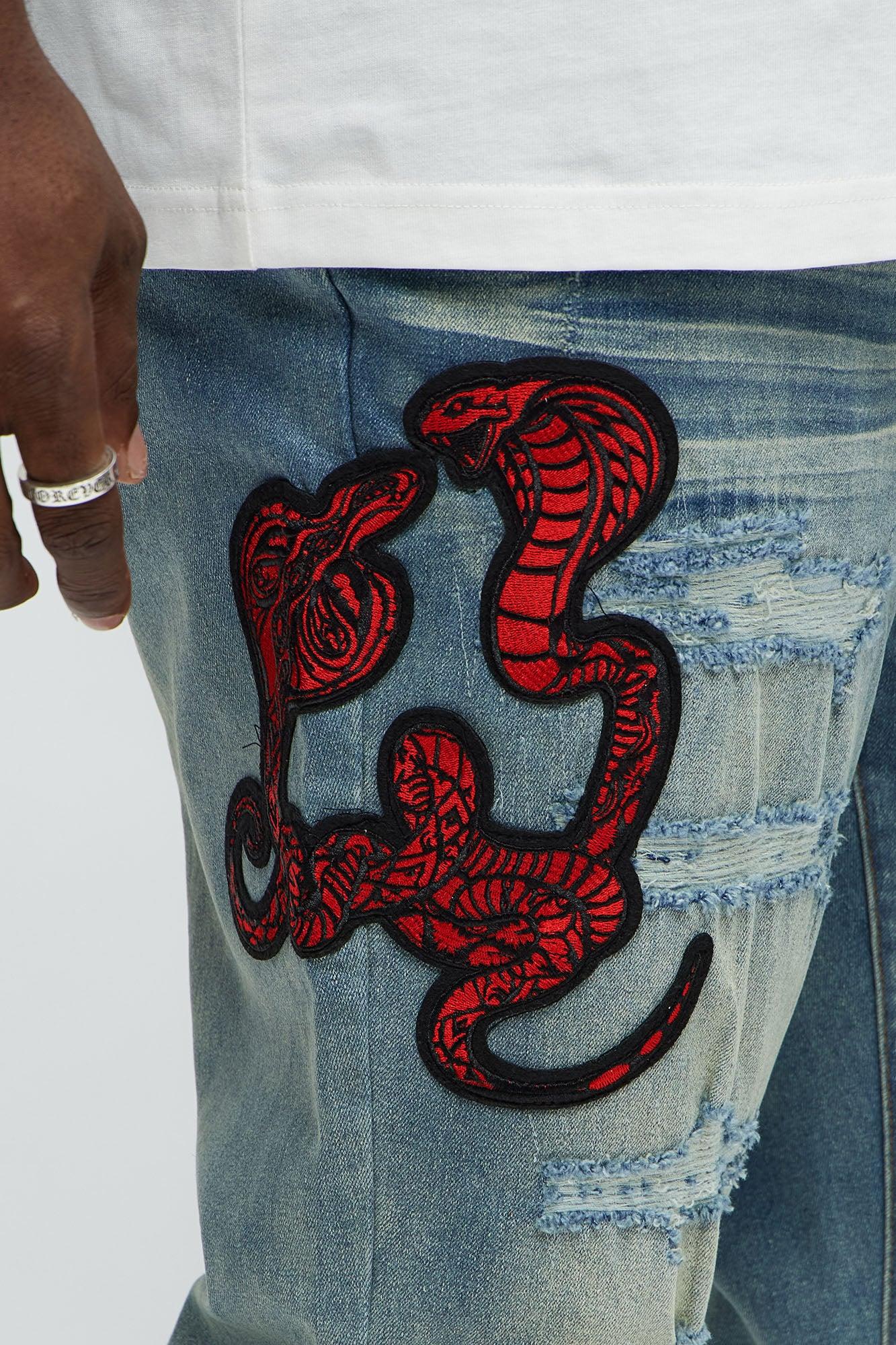 Side Snake Rip And Repair Stacked Skinny Jeans - Vintage Blue Wash Product Image