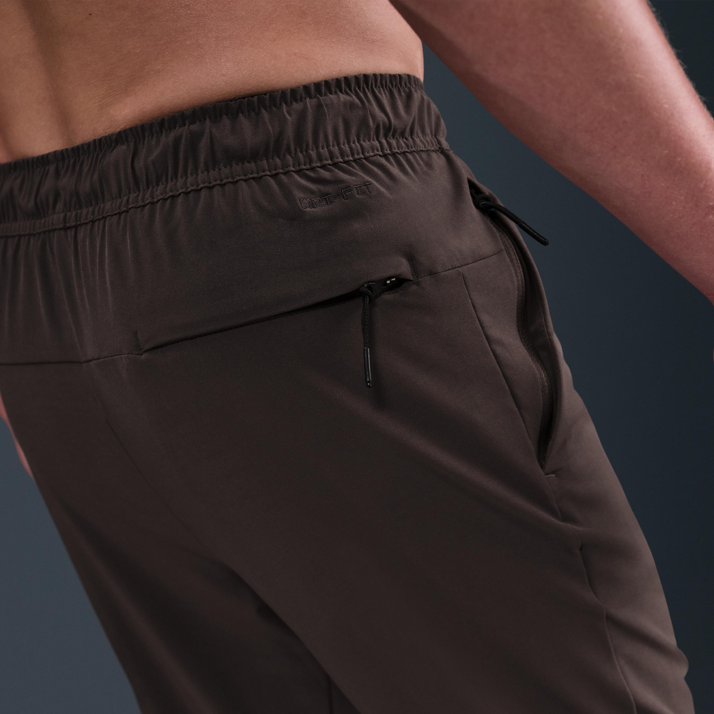 Nike Mens Unlimited Dri-FIT Zippered Cuff Versatile Pants | FB7548-237 Product Image