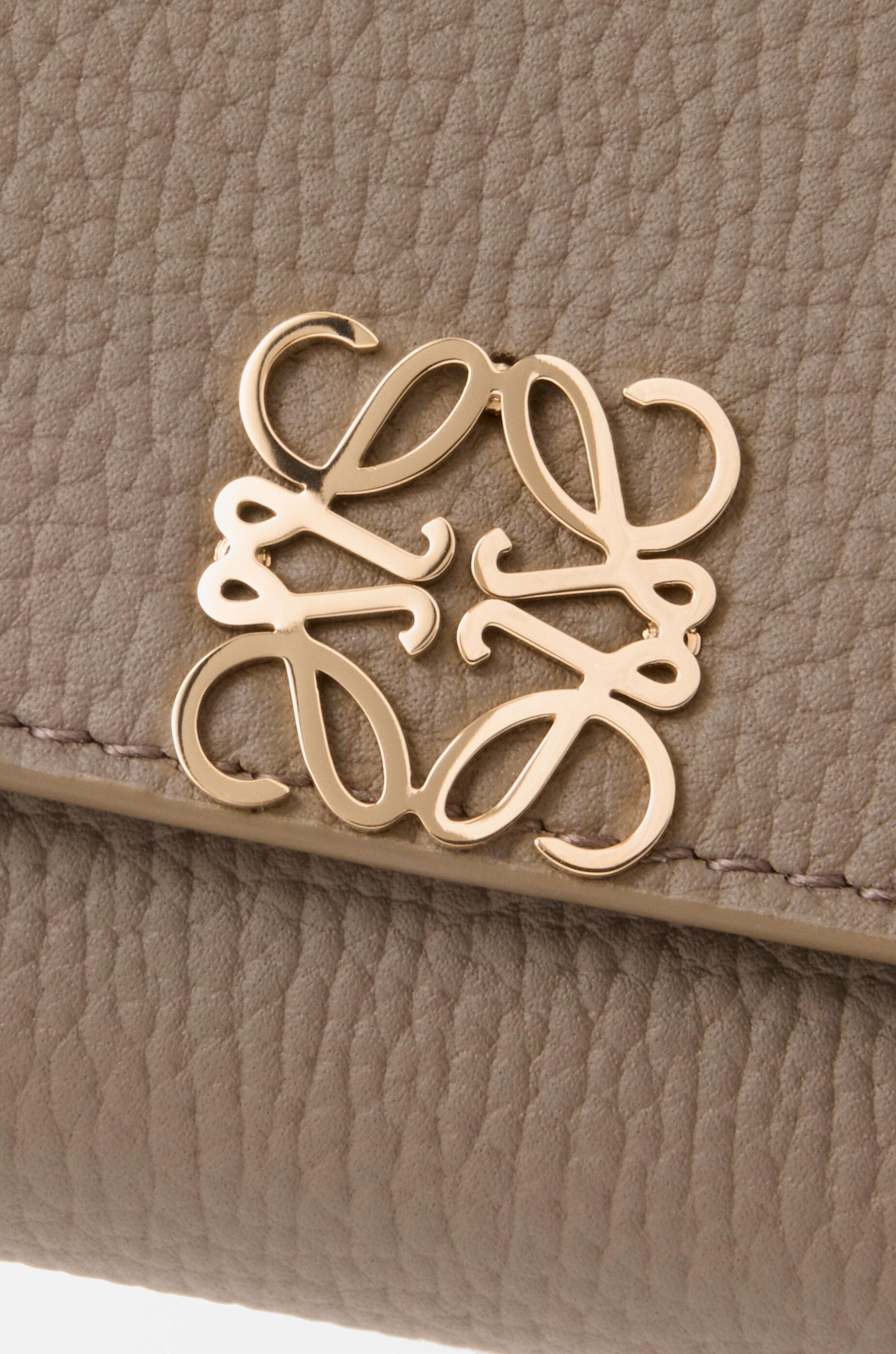 Anagram small vertical wallet in pebble grained calfskin Product Image