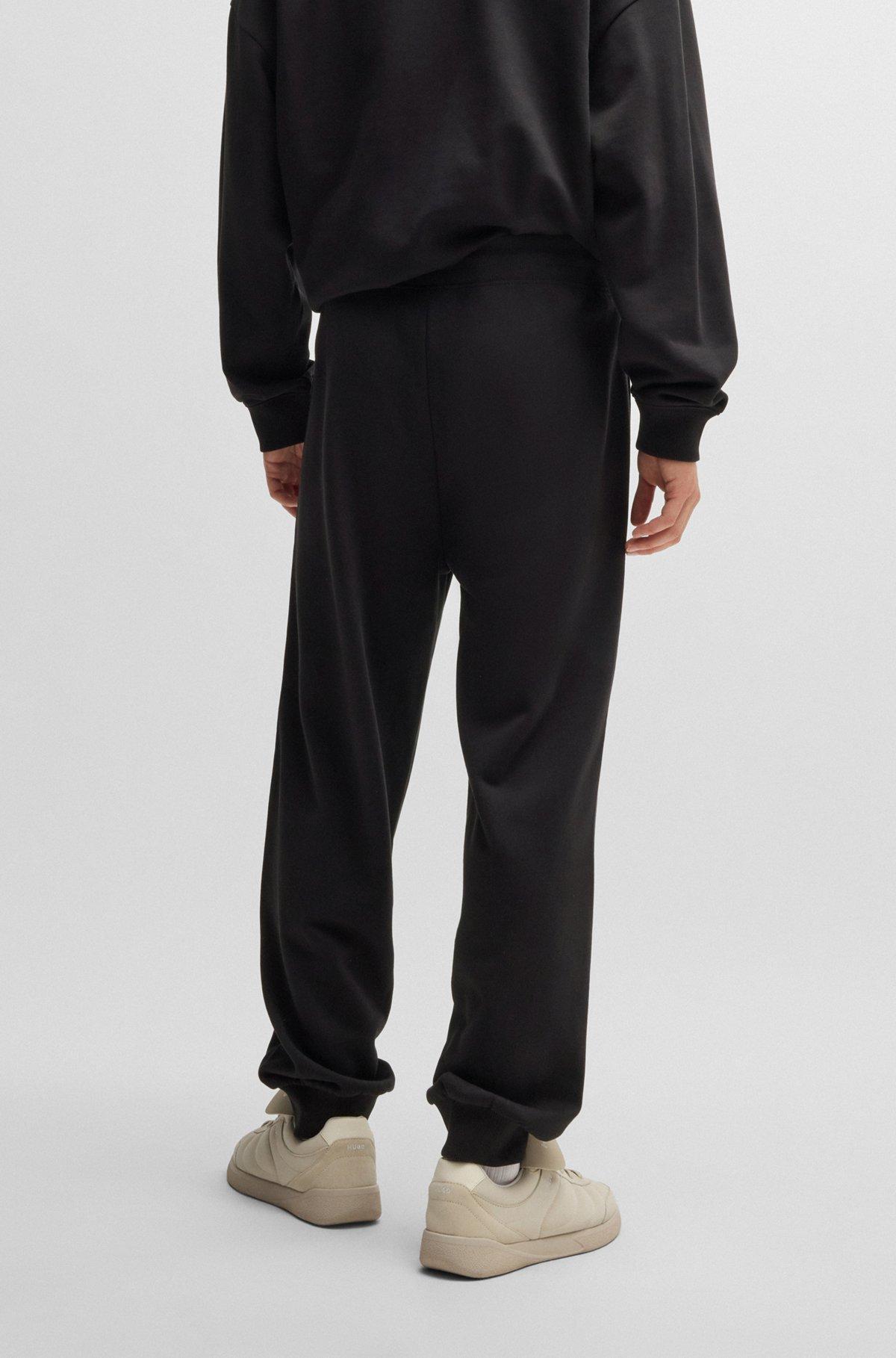 Cotton-terry tracksuit bottoms with chain-stitch logo Product Image