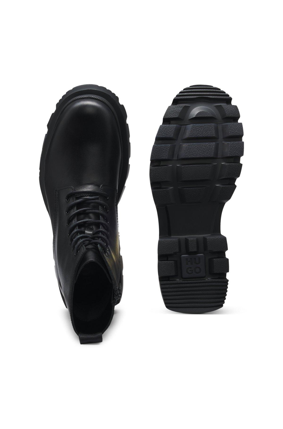Lace-up calf-leather boots with lug sole Product Image