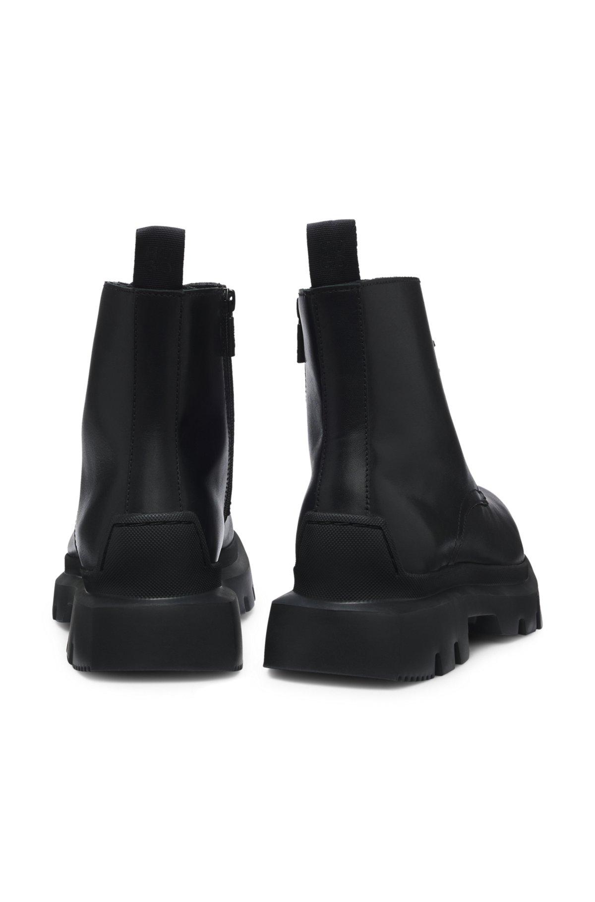 Lace-up calf-leather boots with lug sole Product Image