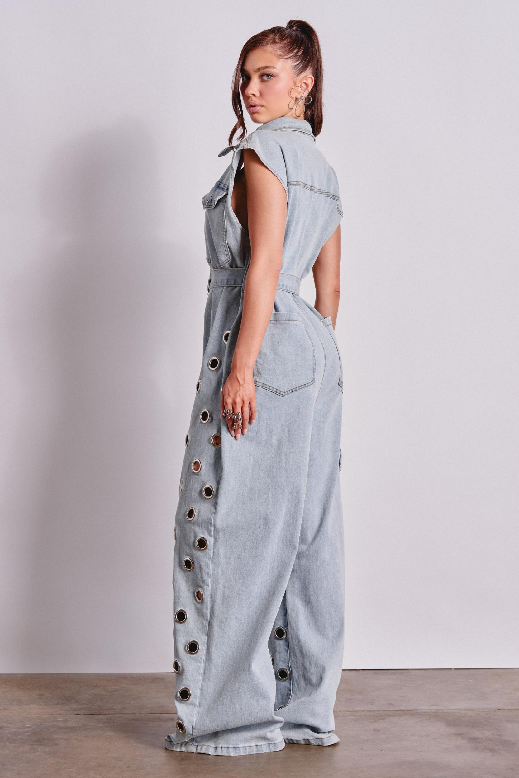 PLAY YOUR CARDS RIGHT DENIM JUMPSUIT WITH GROMMETS IN LIGHT WASH Product Image