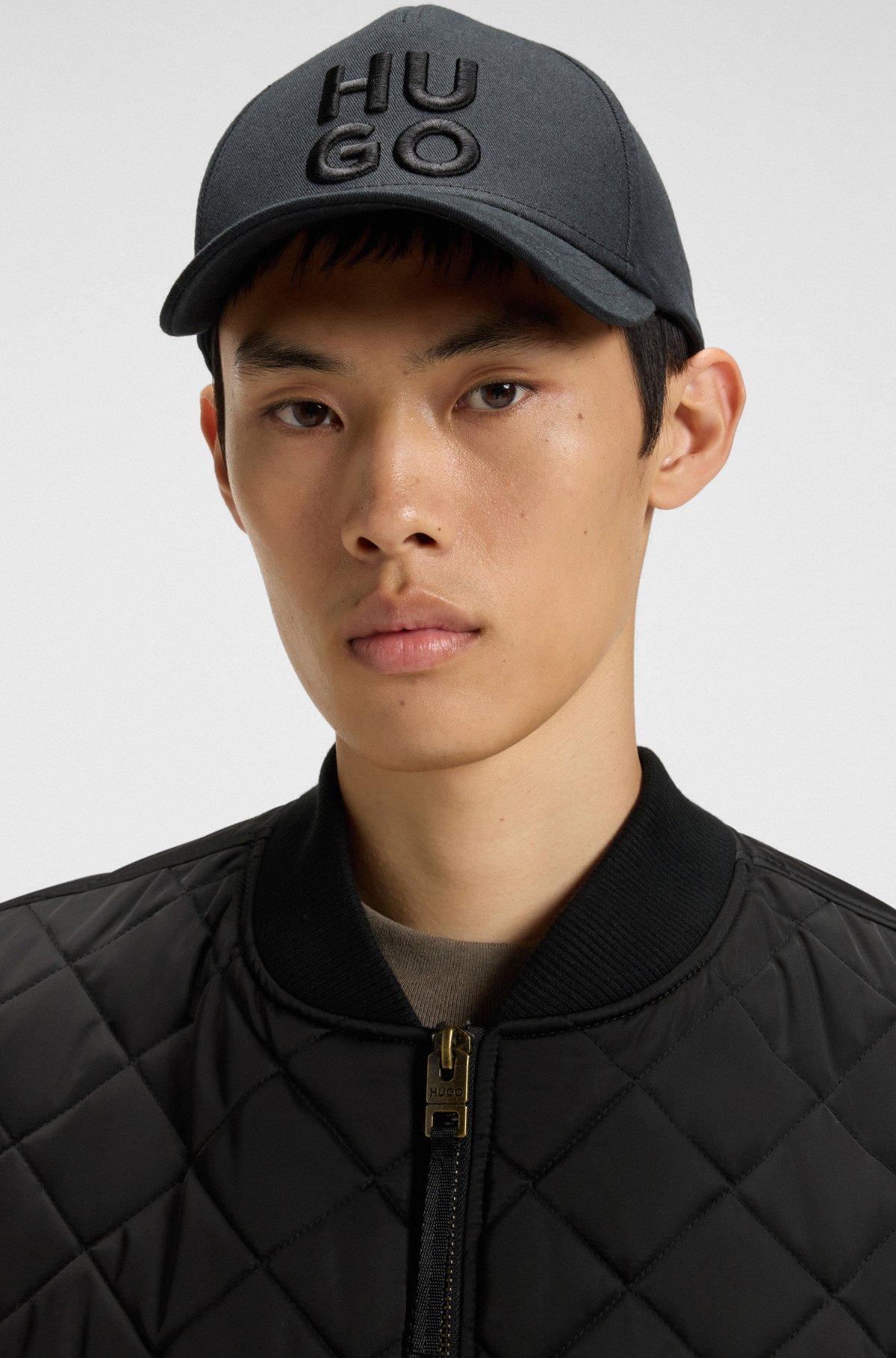 Water-repellent gilet in quilted satin with logo plaque Product Image