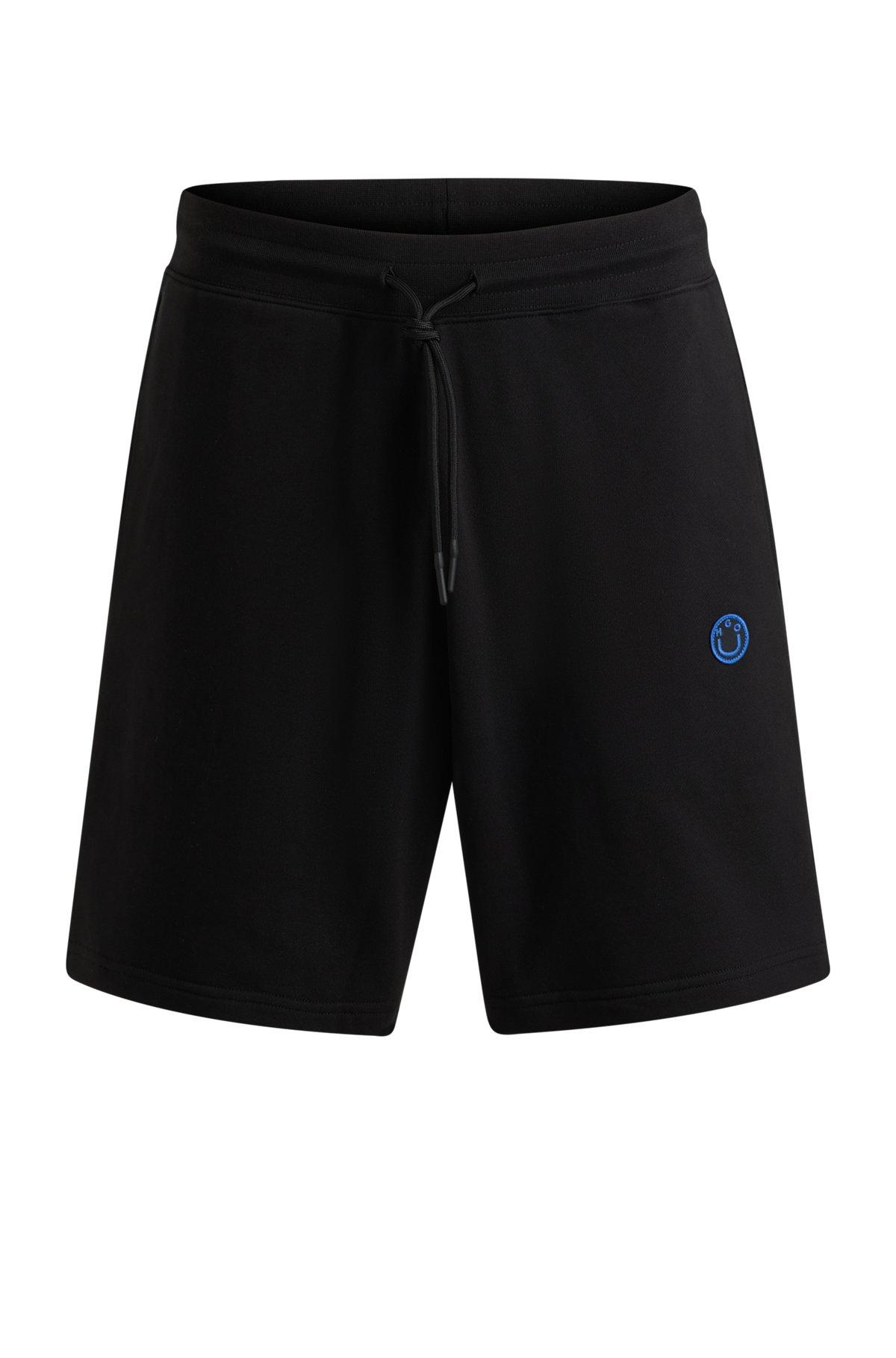 Cotton-terry shorts with Happy HUGO logo Product Image