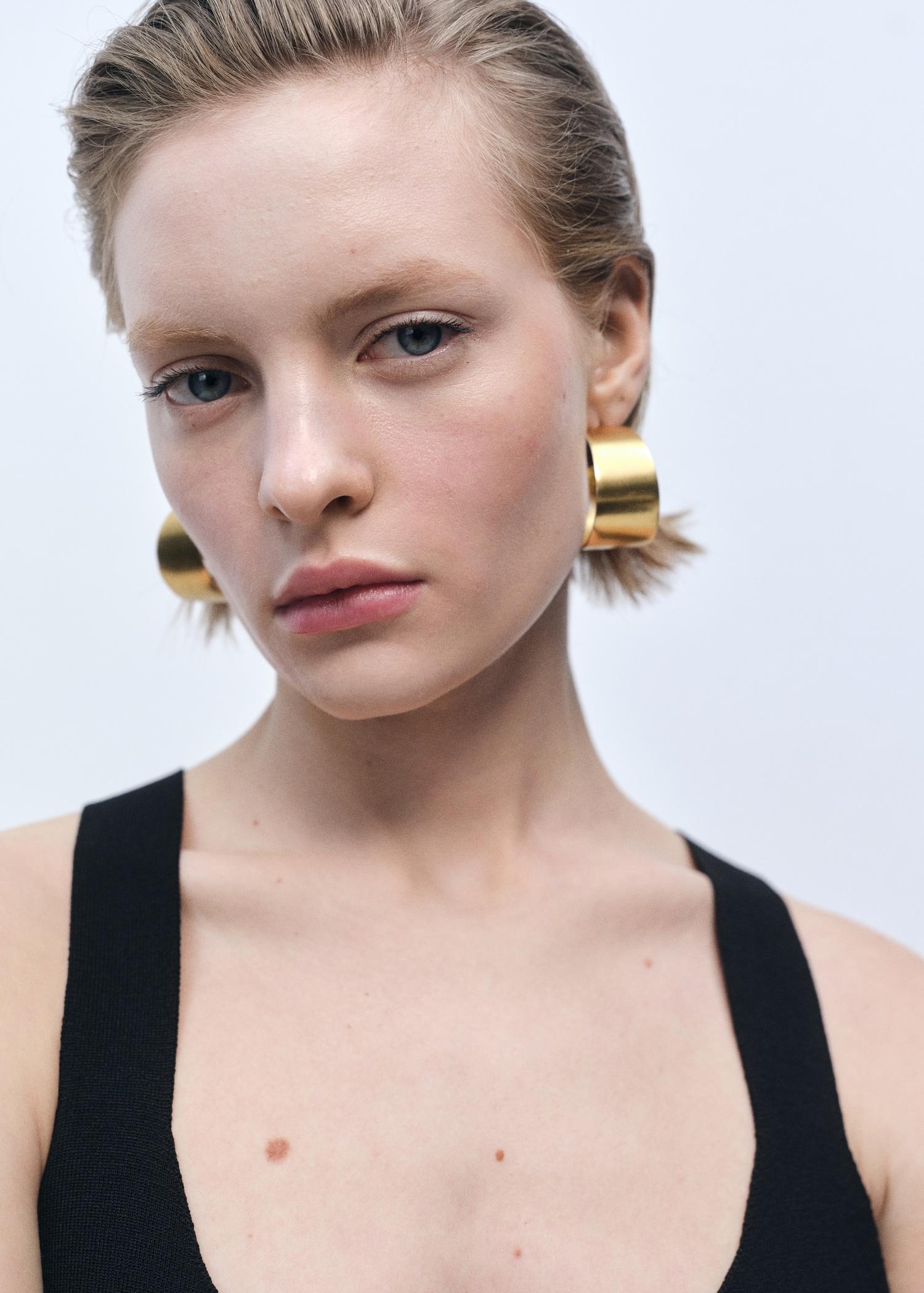 Fine-knit peplum top - Women | MANGO USA Product Image