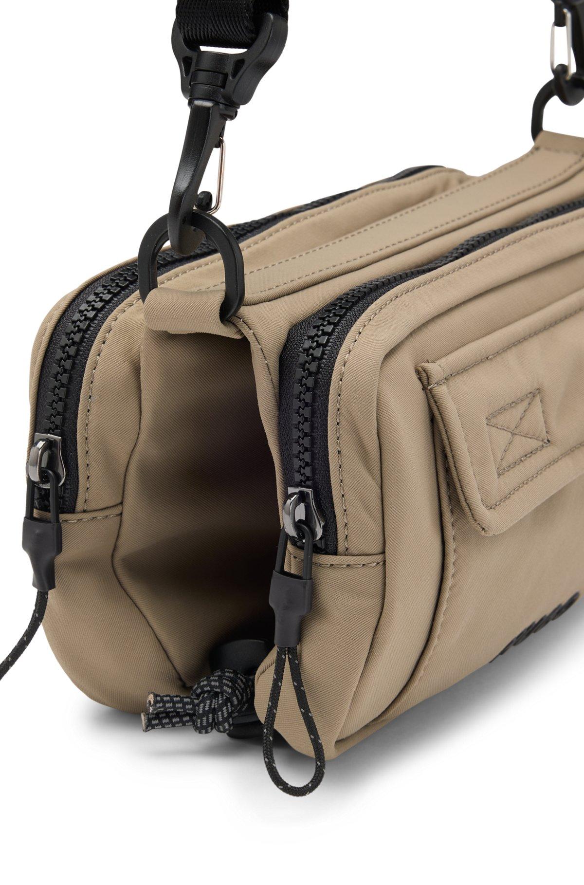 Multi-pocket crossbody bag with contrast branding Product Image