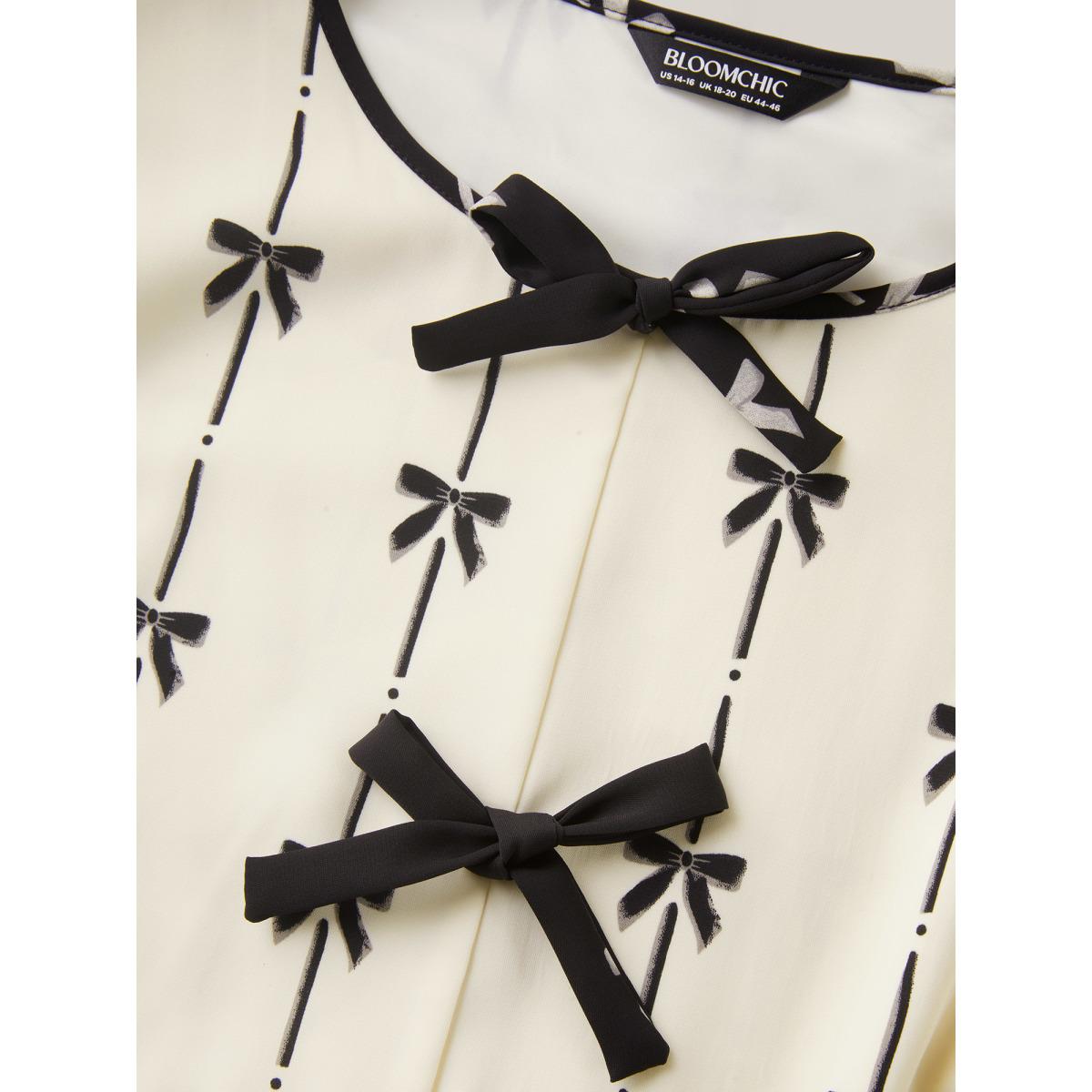 Plus Size Beige Bow Detail Printed Color Contrast Blouse Women Romantic Half Sleeve V-neck Elegant Blouses BloomChic 30/6X Product Image