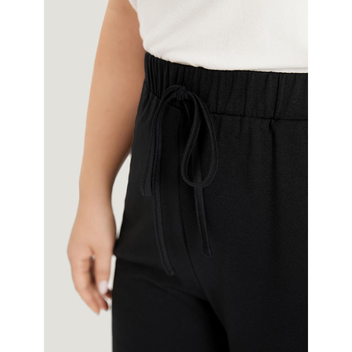 Plain Slant Pocket Crisscross Hem Skinny Sweatpants Black Plus Size Women Casual Dailywear Cross straps 14-16/1X Bloomchic Product Image