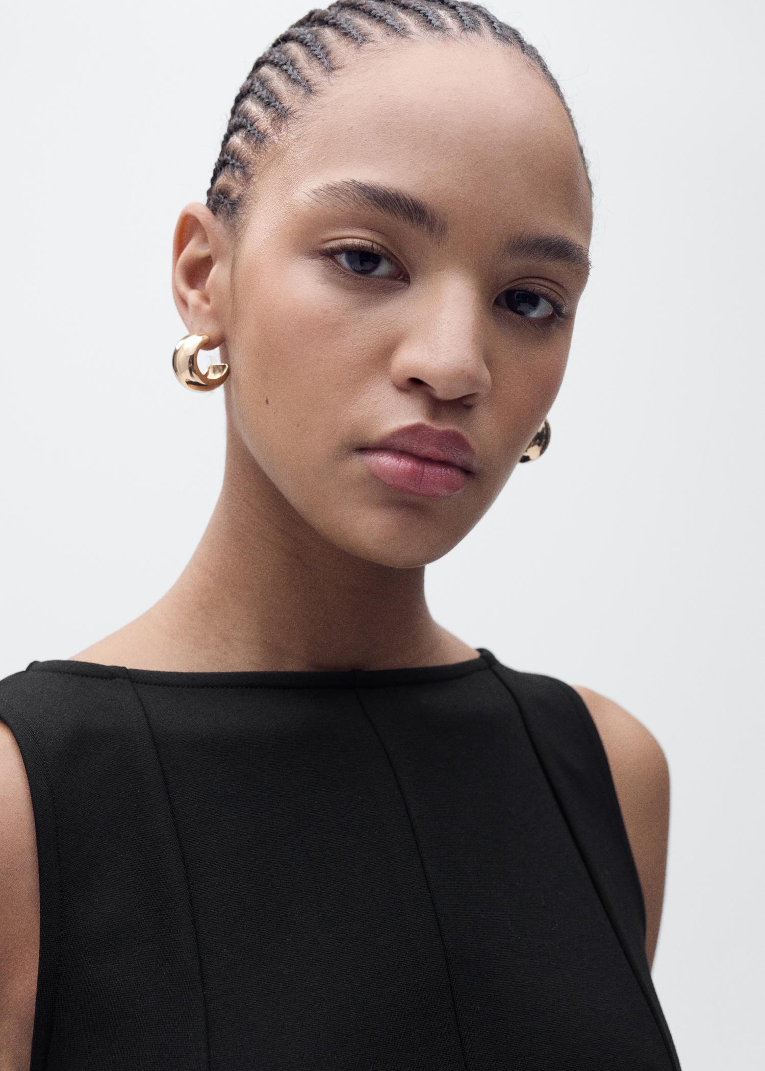 Peplum top with seam detail - Women | MANGO USA Product Image