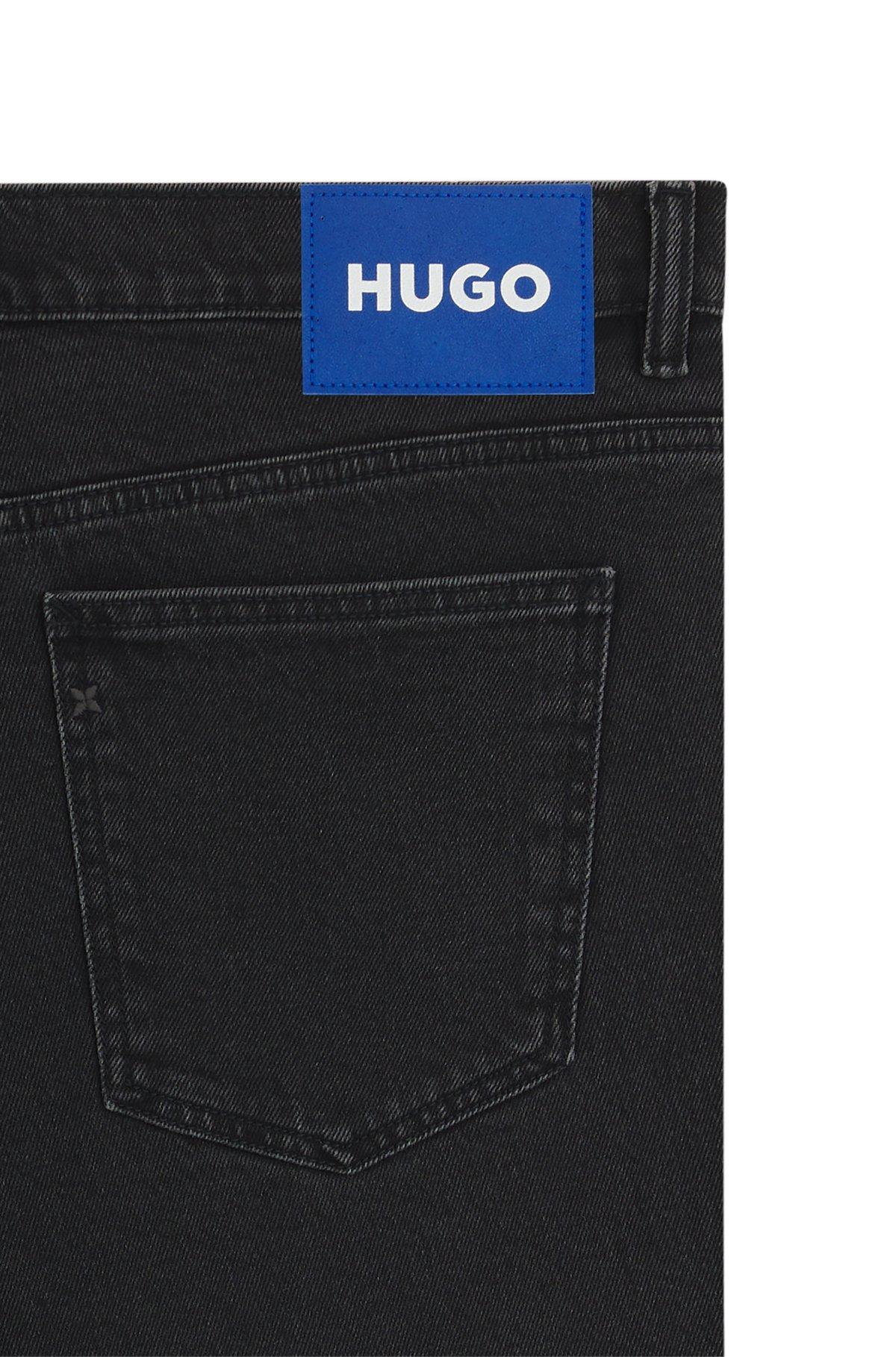Tapered-fit jeans in grain-effect black denim Product Image