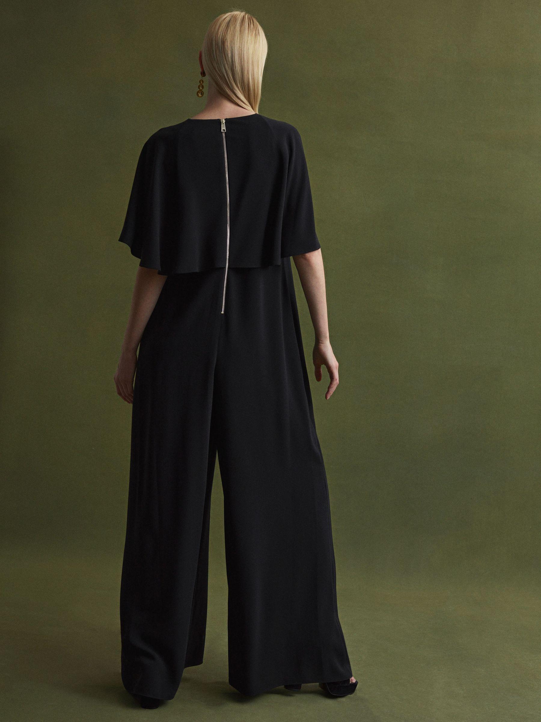 Florere Relaxed Fit Cape Sleeve Jumpsuit in Black Product Image
