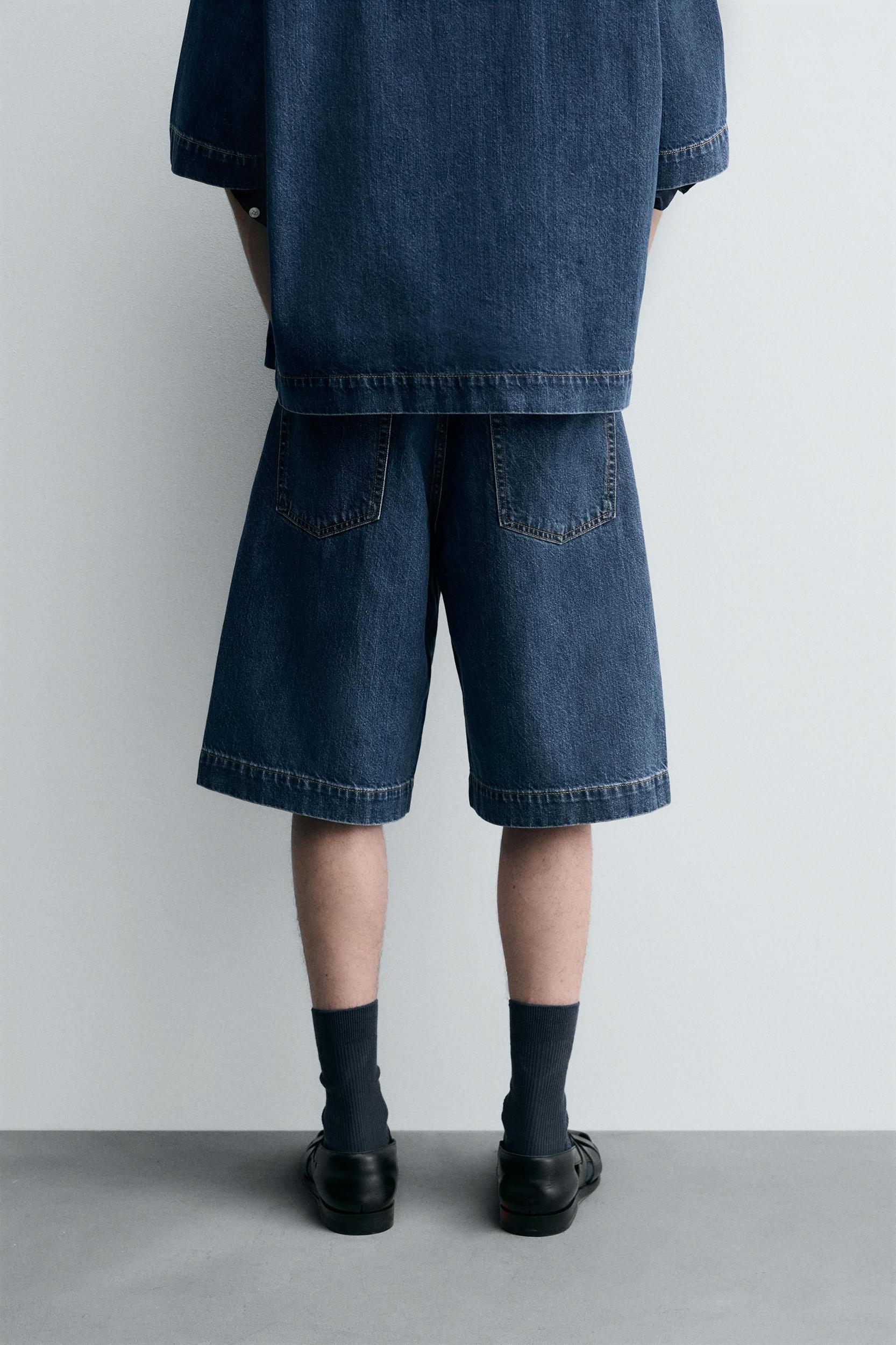 PLEATED RELAXED FIT DENIM SHORTS Product Image