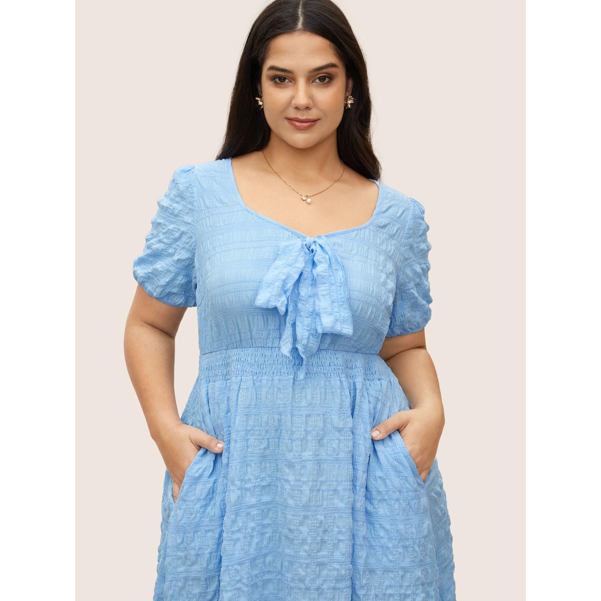 Plus Size Citrus Plain Texture Shirred Tie Knot Lantern Sleeve Dress LightBlue Women Elegant Tie knot Heart neckline Short sleeve Curvy Midi Dress BloomChic 14-16/1X Product Image