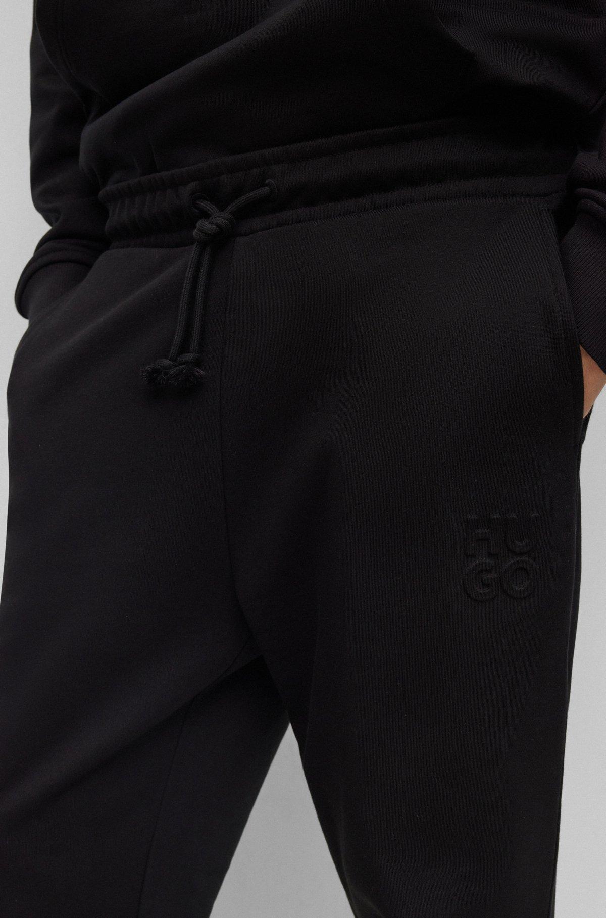 Relaxed-fit cotton-terry tracksuit bottoms with stacked logo Product Image