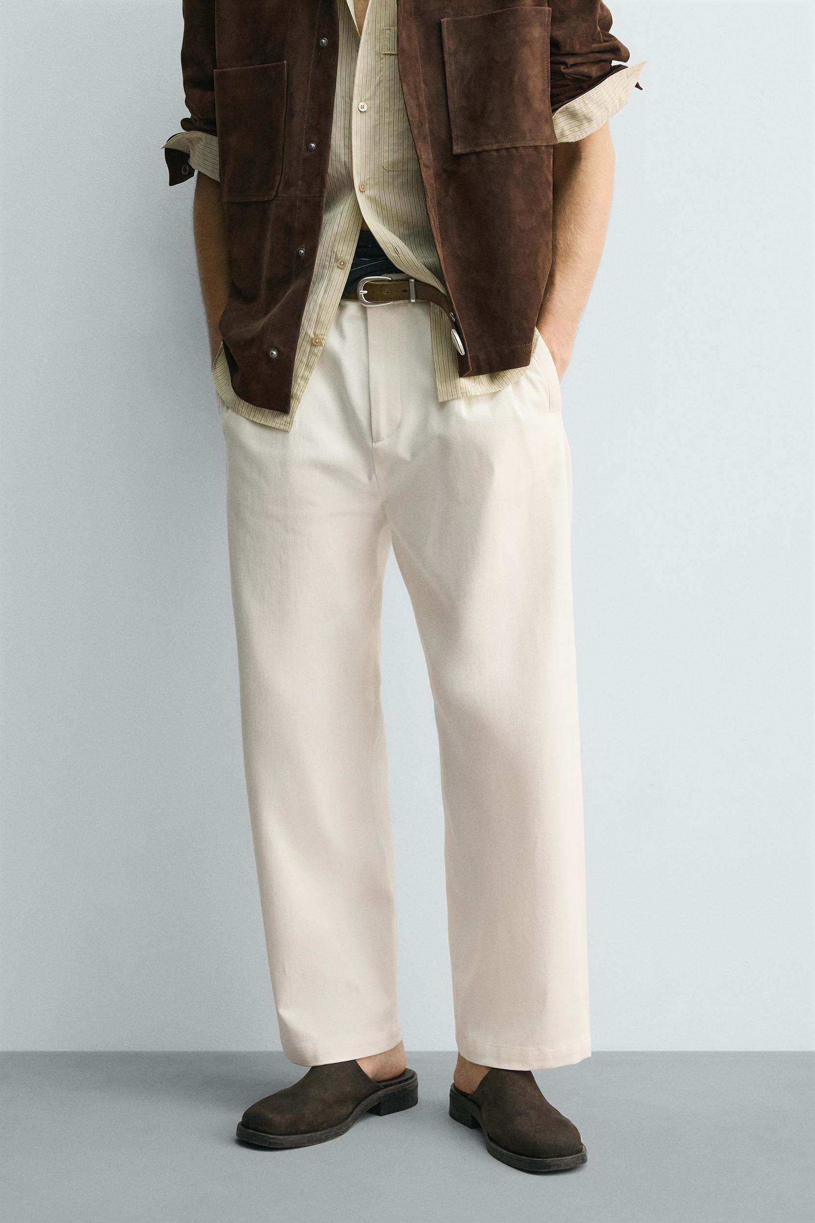 PLEATED WIDE FIT CHINO PANTS Product Image