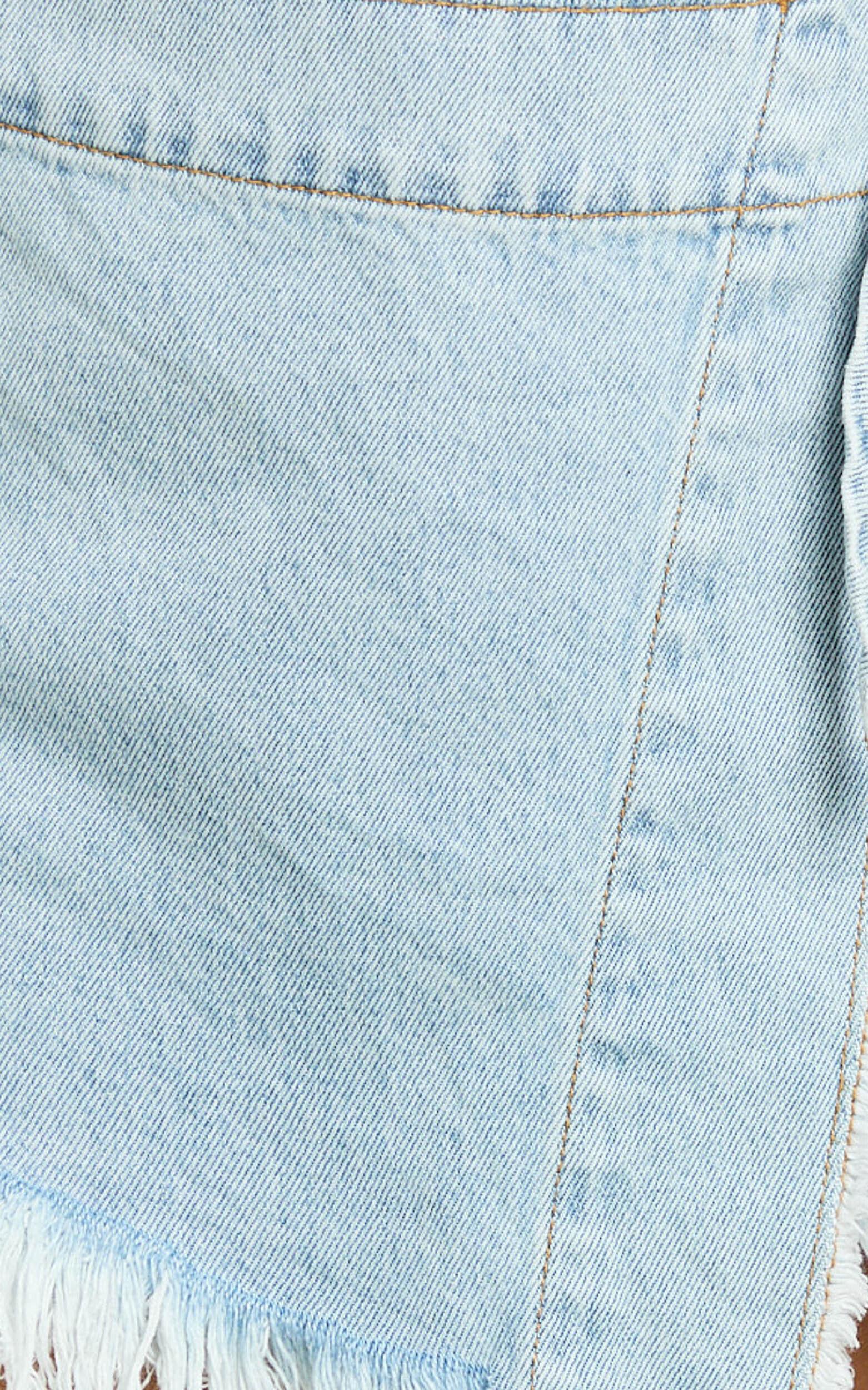 Ellyza Skort - Recycled Cotton Frayed Edge Wrap Denim Skort in Mid Blue Wash Product Image