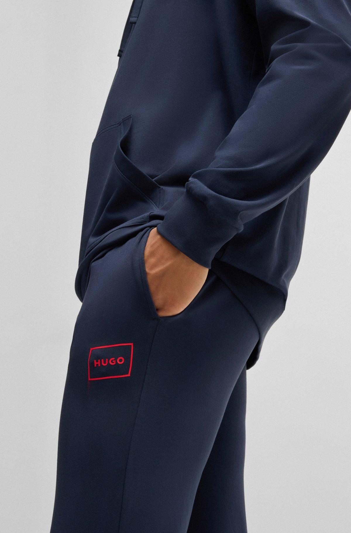 Logo-print tracksuit bottoms in stretch cotton Product Image