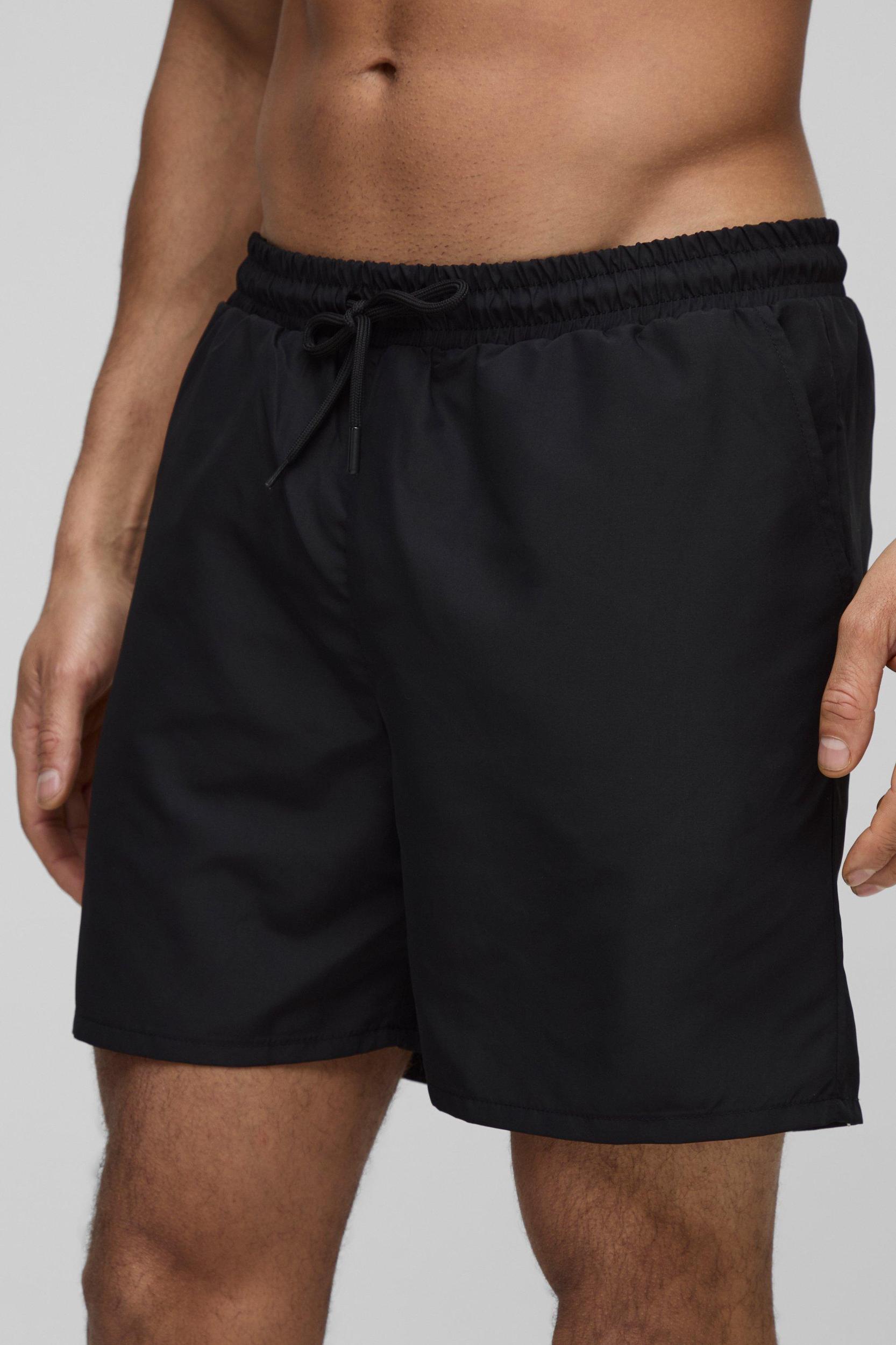 Man Embroidered Mid Length Swim Trunks | boohooMAN USA Product Image