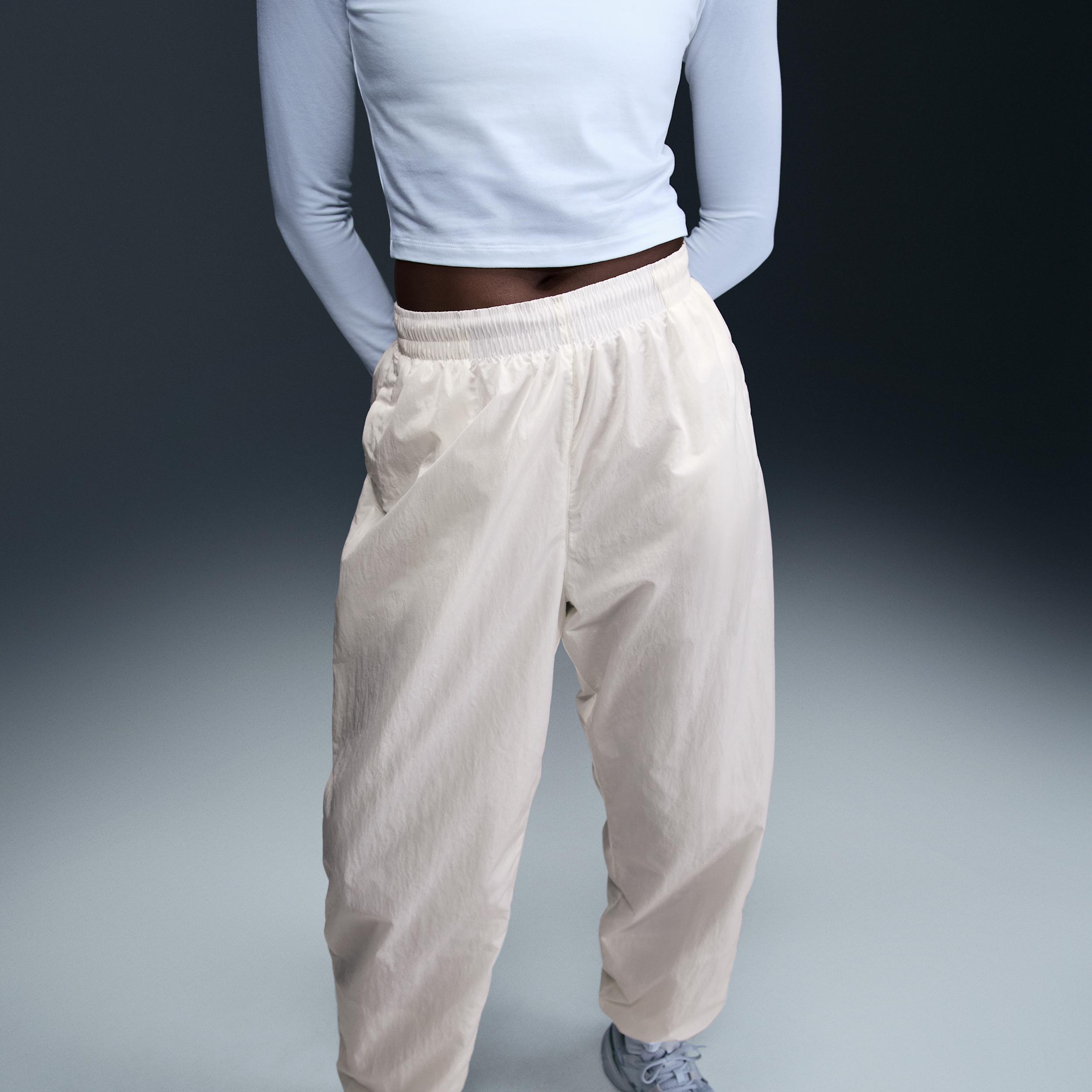 Womens Nike Sportswear Essential Mid-Rise Oversized Woven Jogger Pants | FV7668-004 Product Image