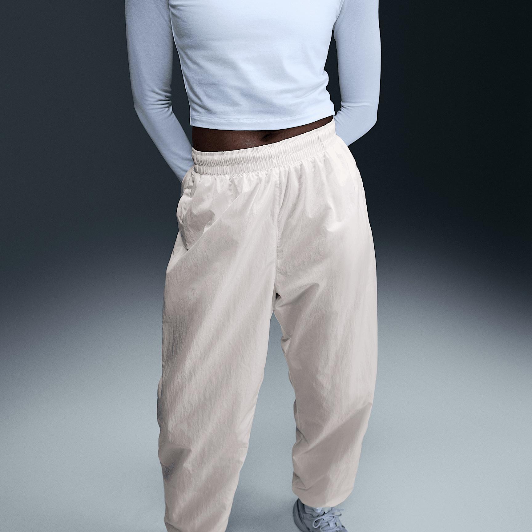 Womens Nike Sportswear Essential Mid-Rise Oversized Woven Jogger Pants | FV7668-004 Product Image