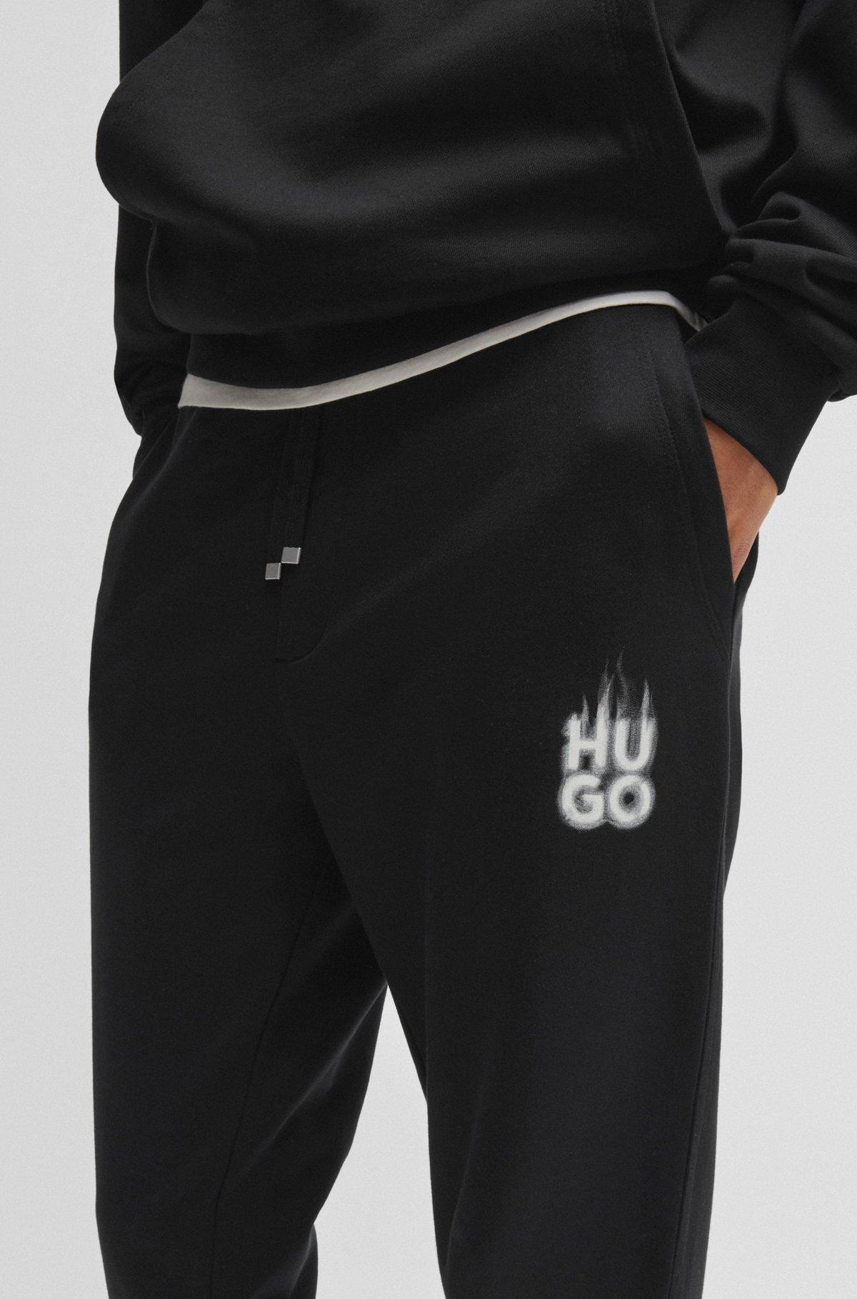 Cotton-terry tracksuit bottoms with smoke logo Product Image