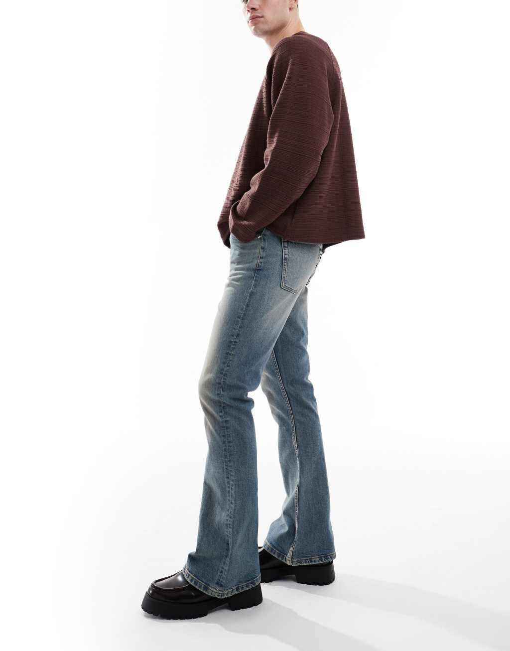 ASOS DESIGN stretch flare jeans in light wash blue with tint Product Image