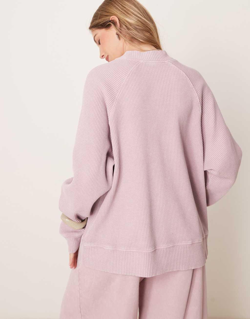 ASOS DESIGN raglan high neck long sleeve top in waffle in washed mauve Product Image