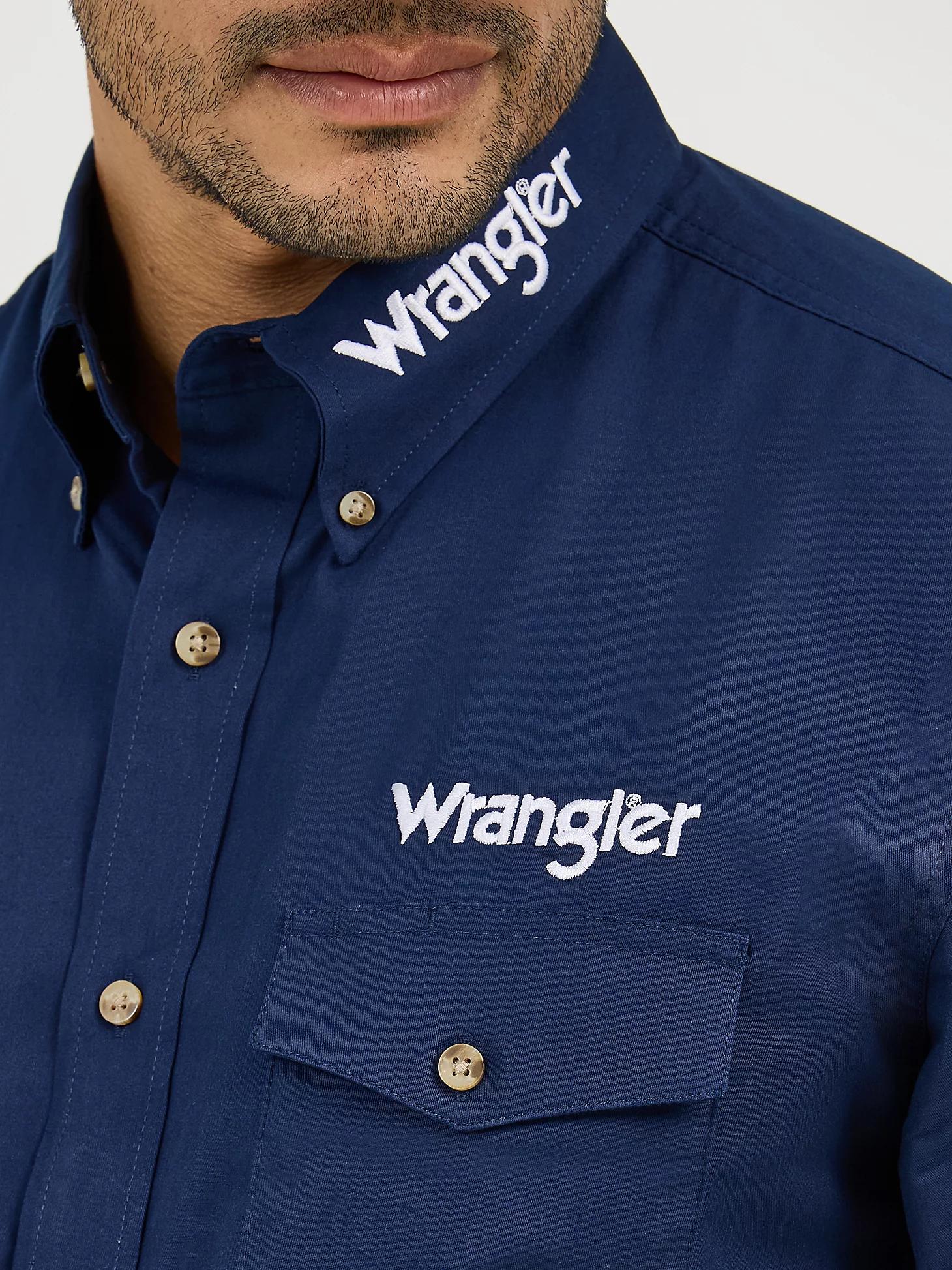 Men's Wrangler® Logo Long Sleeve Button Down Solid Shirt | Men's SHIRTS | Wrangler® Product Image