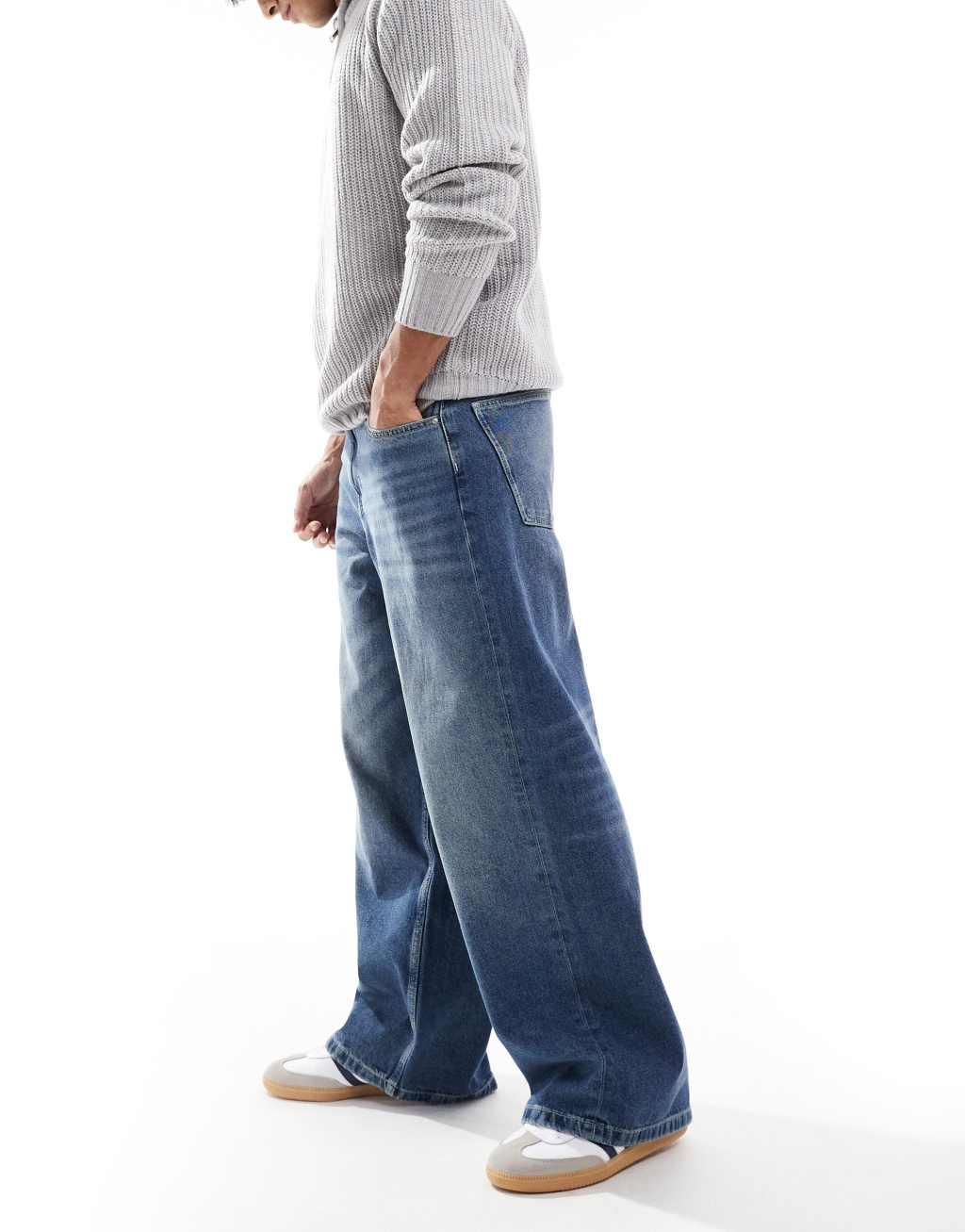 ASOS DESIGN super baggy jeans in mid wash blue Product Image