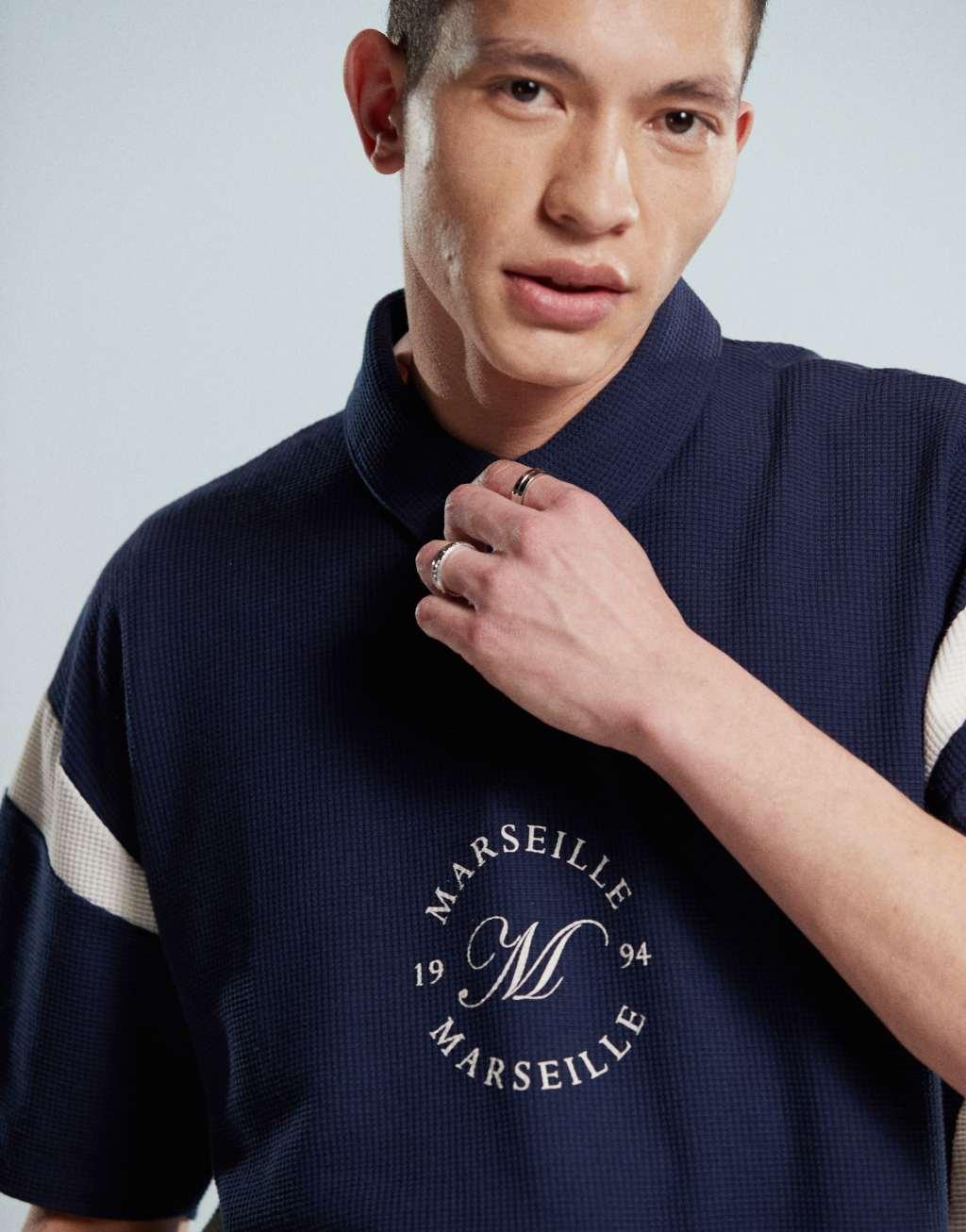 ASOS DESIGN boxy heavyweight 230gsm waffle texture oversized polo with paneling and chest print in navy Product Image